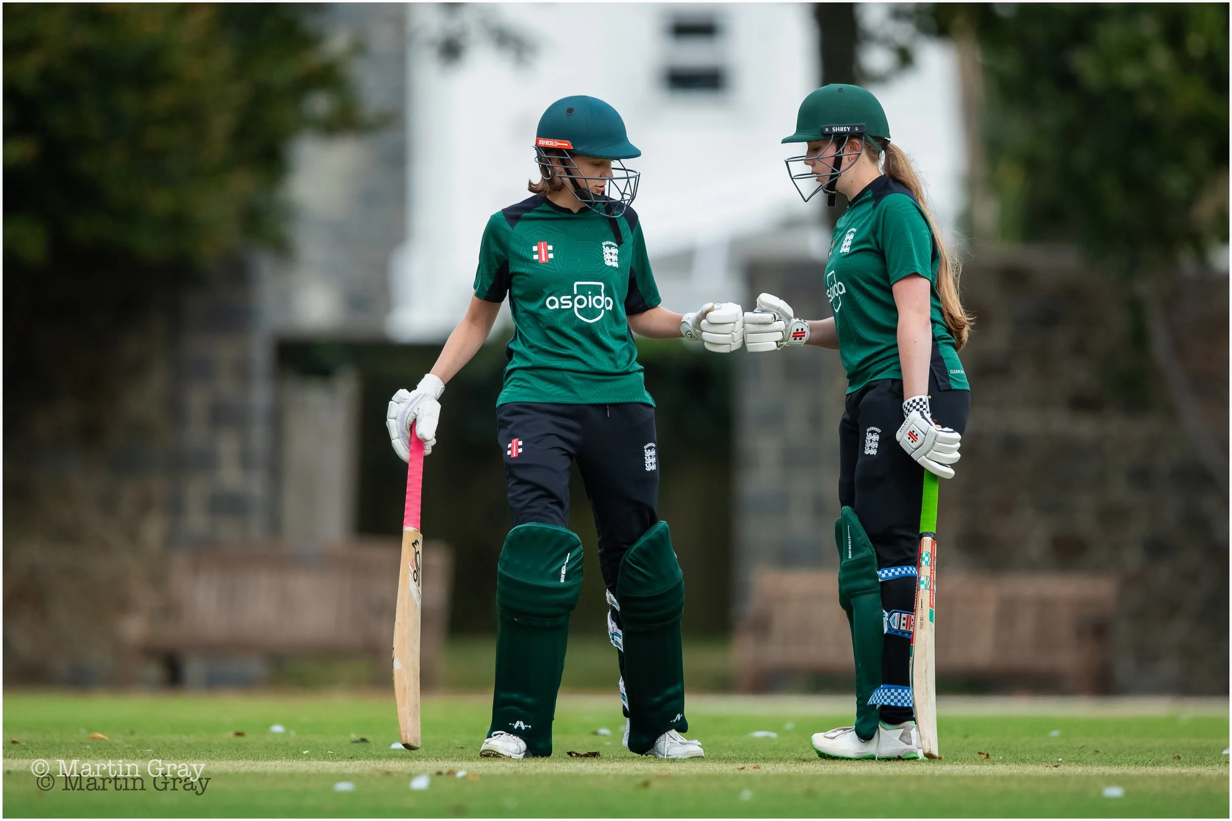 Molly Robinson and Annie Le Ray fist pump a Le Ray boundary-7712.jpg