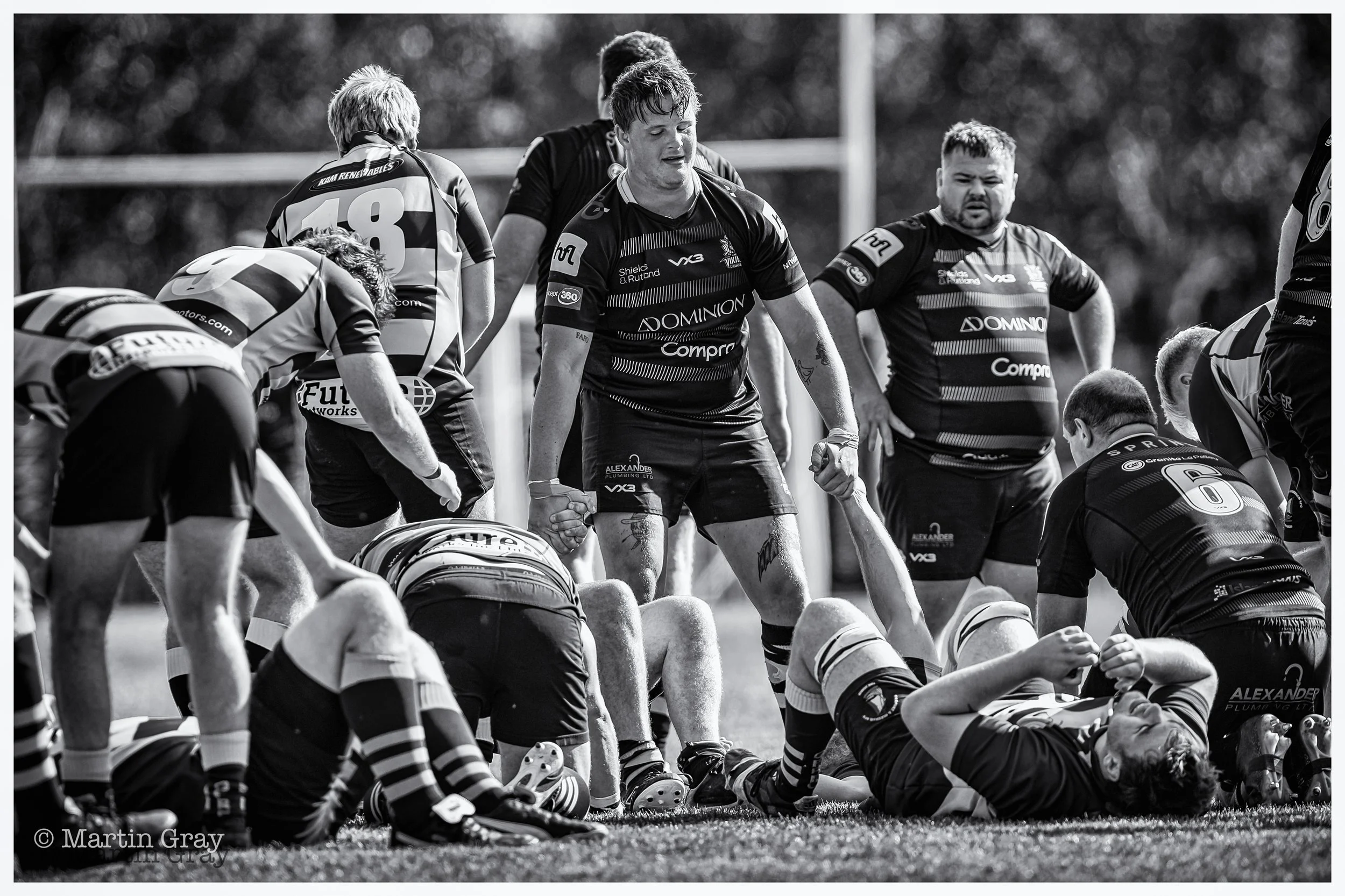 Sam Rushent offers a helping hand as Gosport & Fareham collapse in exhaustion on the final whistle-2.jpg