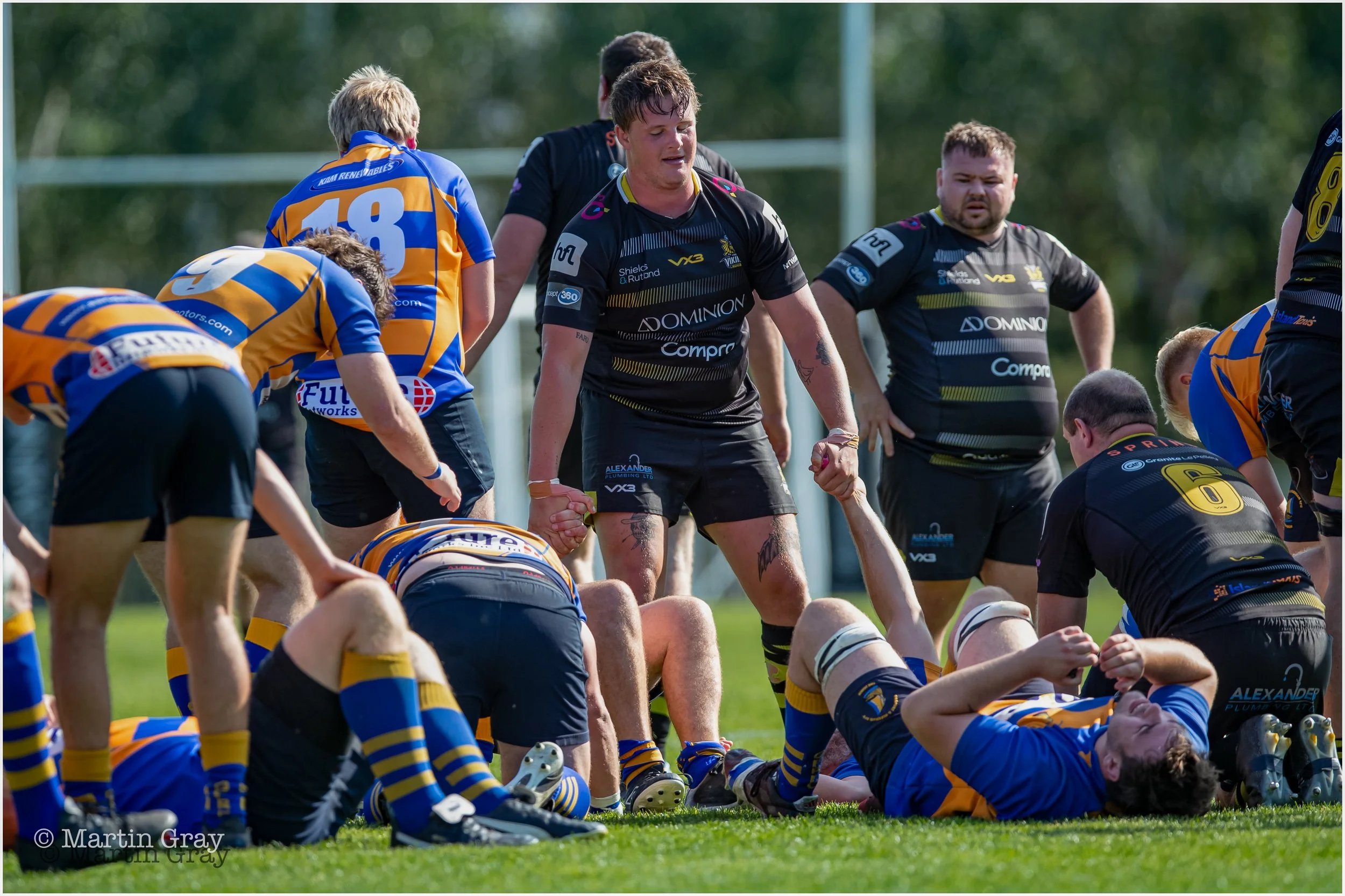 Sam Rushent offers a helping hand as Gosport & Fareham collapse in exhaustion on the final whistle-5448.jpg