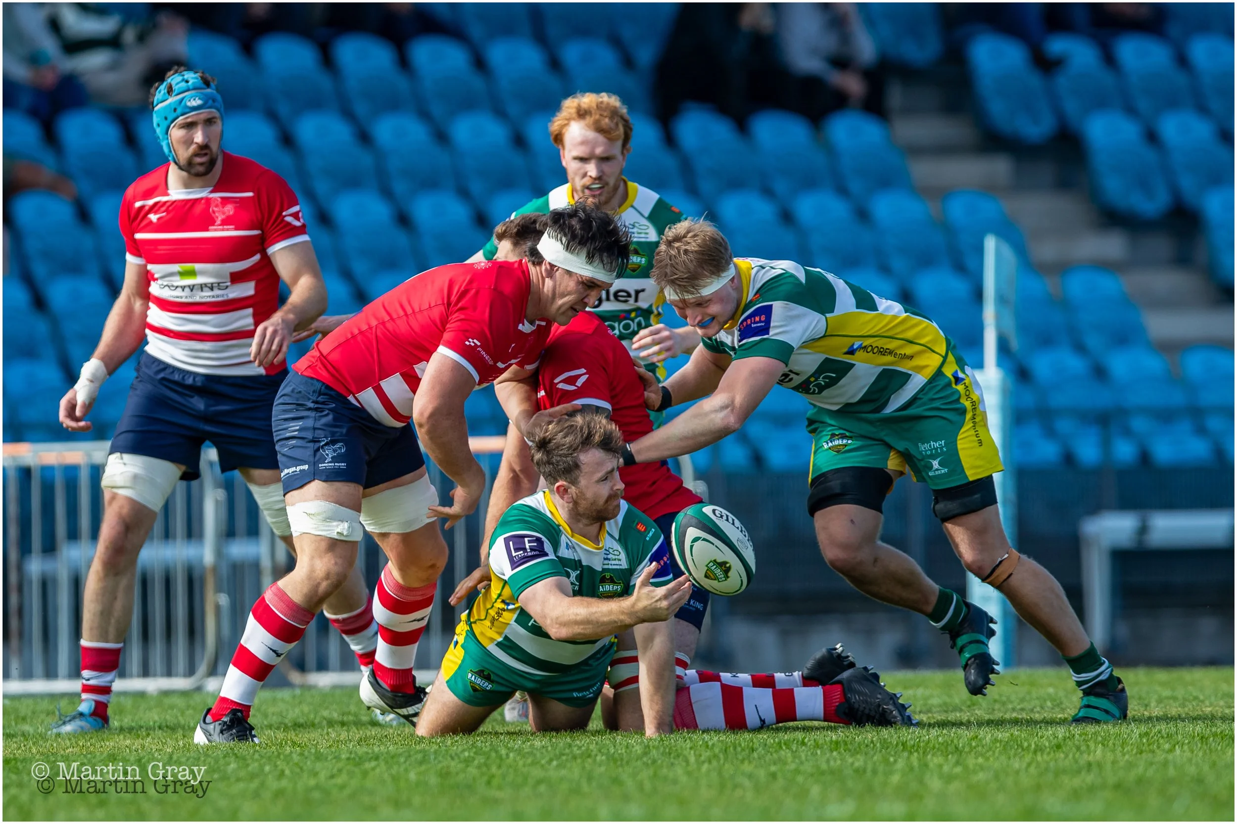 Sam Boyland offloads in a tackle-7766.jpg