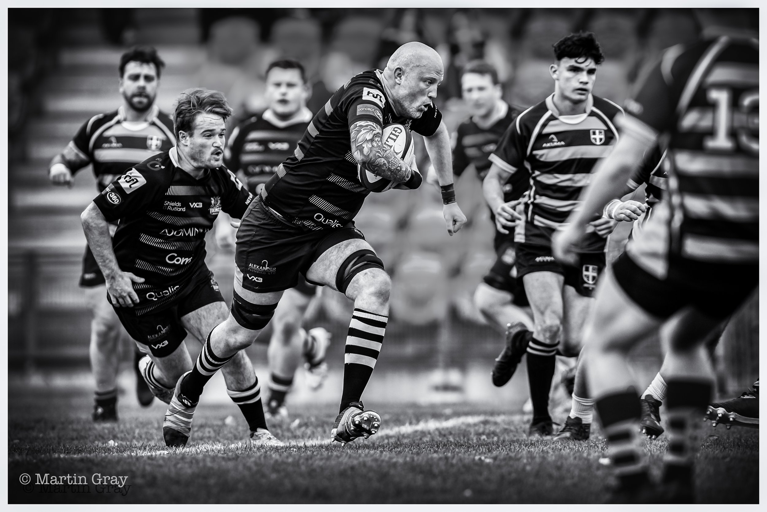 Angus MacCallum powers out of defence B+W-2.jpg