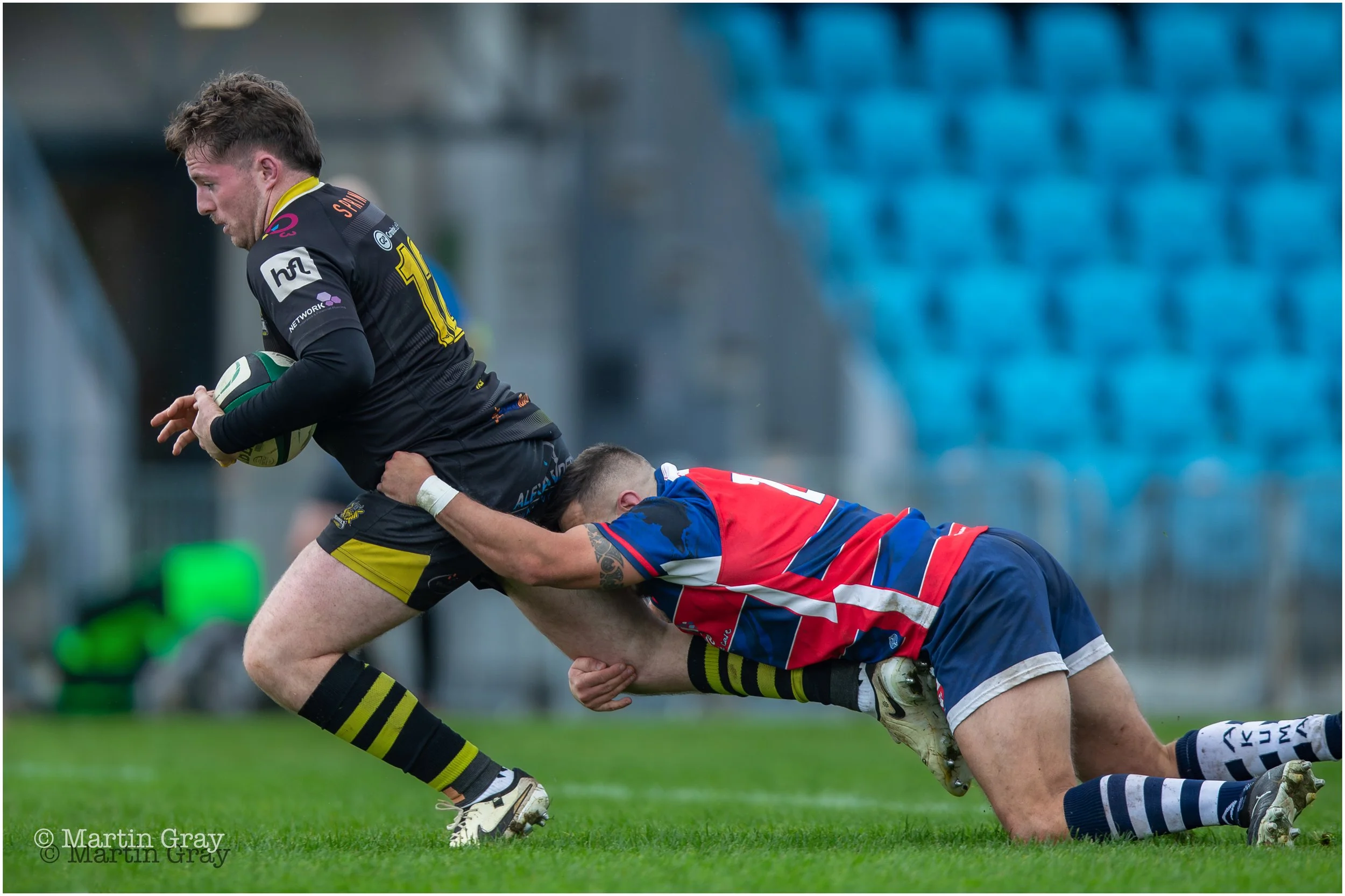 Niall McGann is tackled as Vikings press forward-3453.jpg