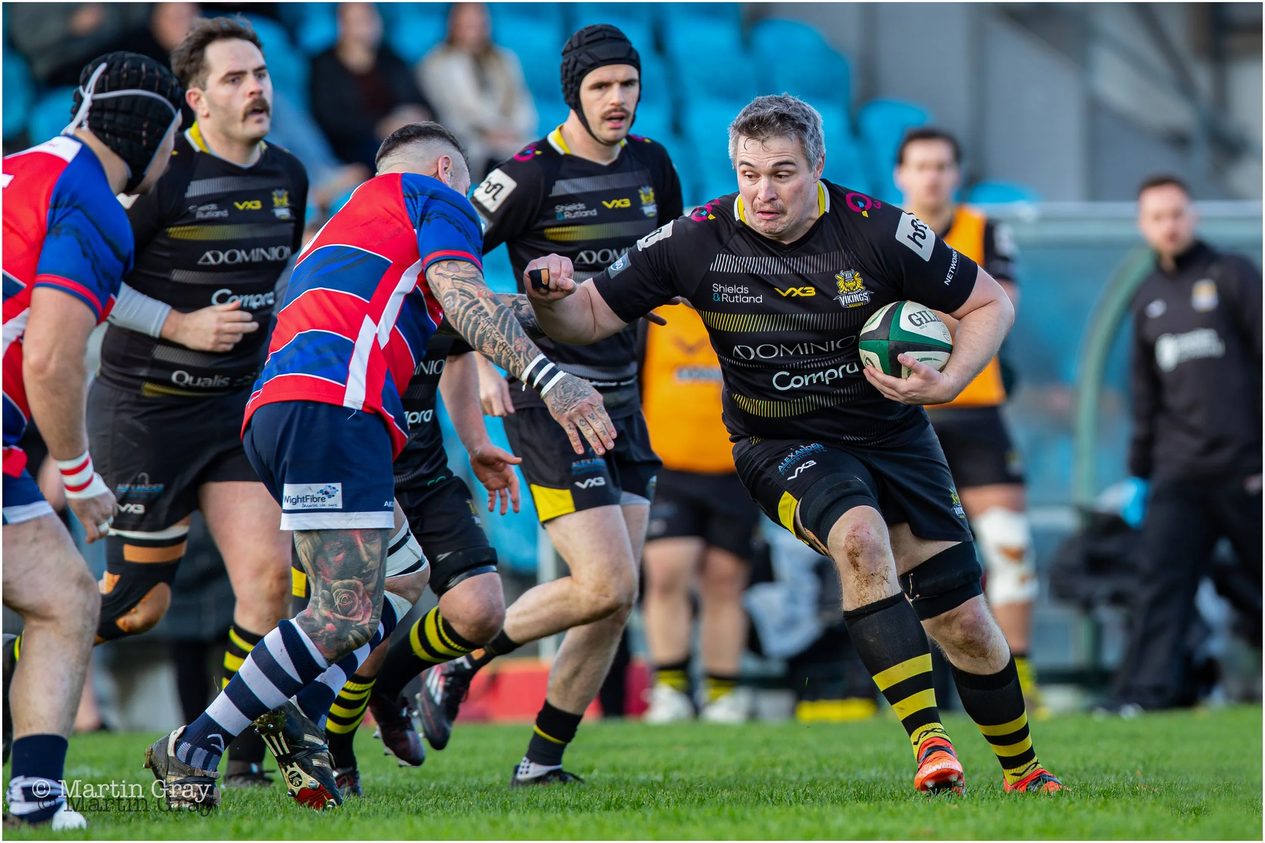 Nick Merrien prepares to hand off an opponent-3205.jpg
