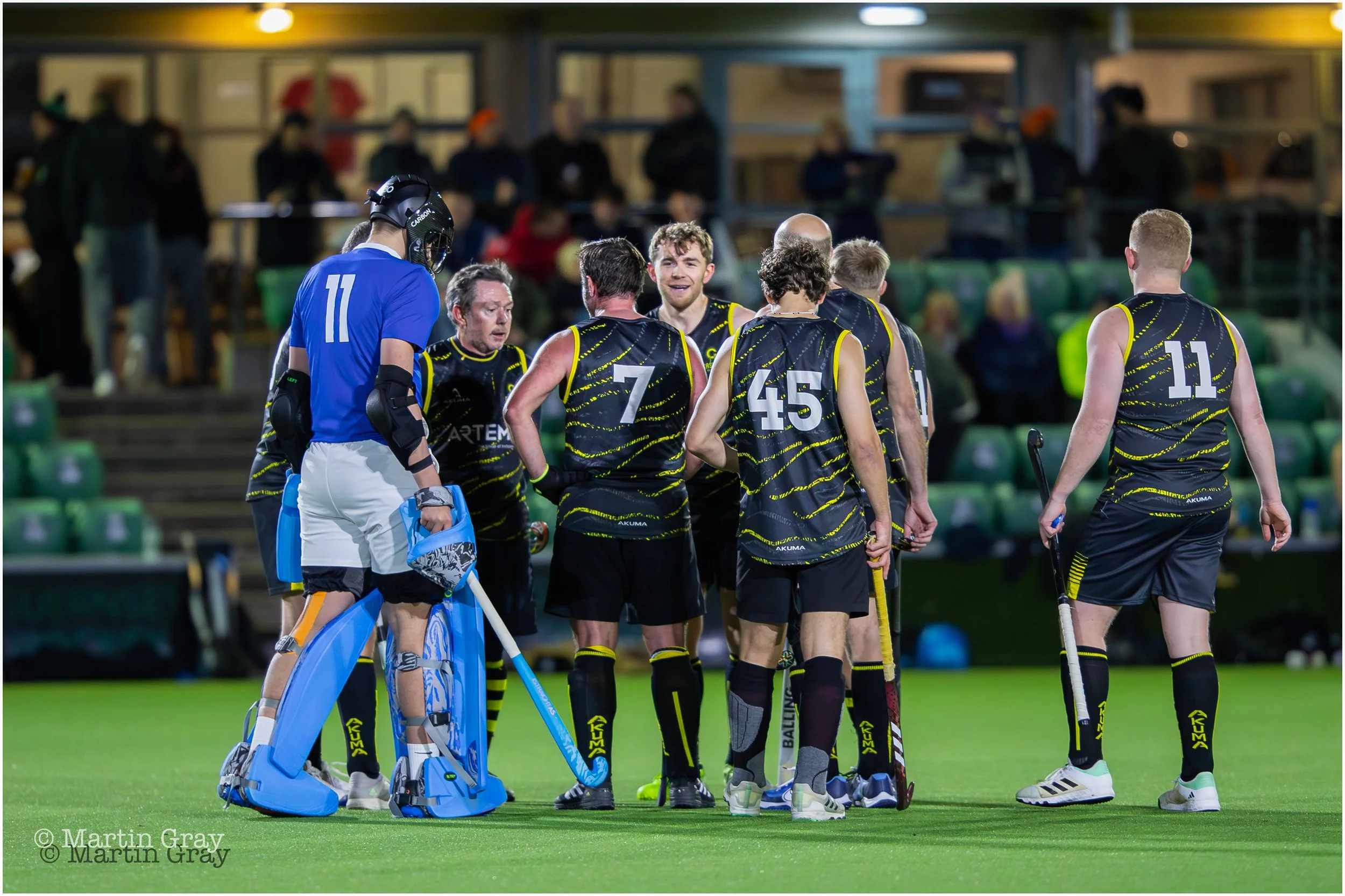 Casuals team huddle at a break in play-4504.jpg