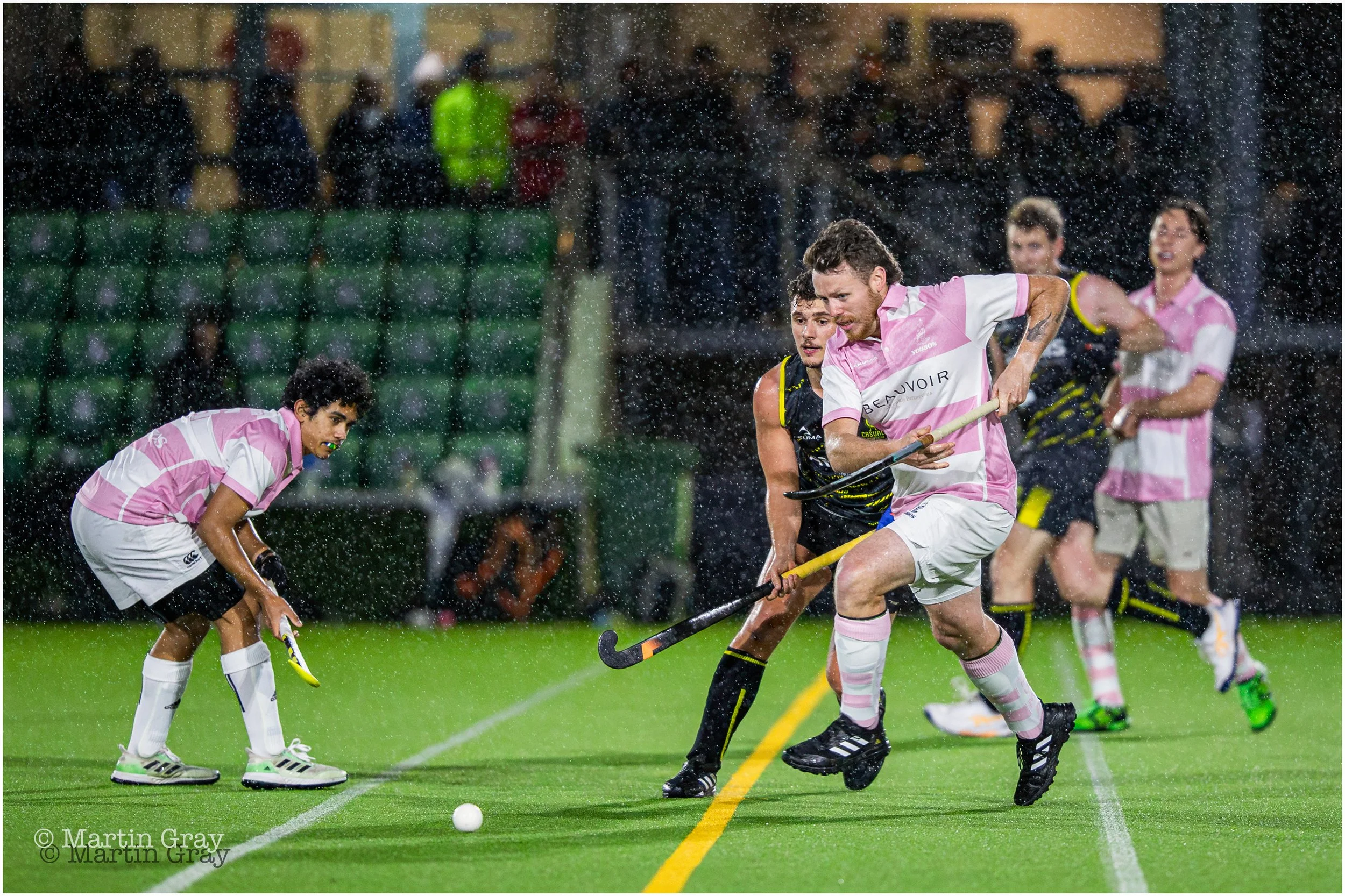 Ryan Gilson chases down a loose ball in the rain-4582.jpg