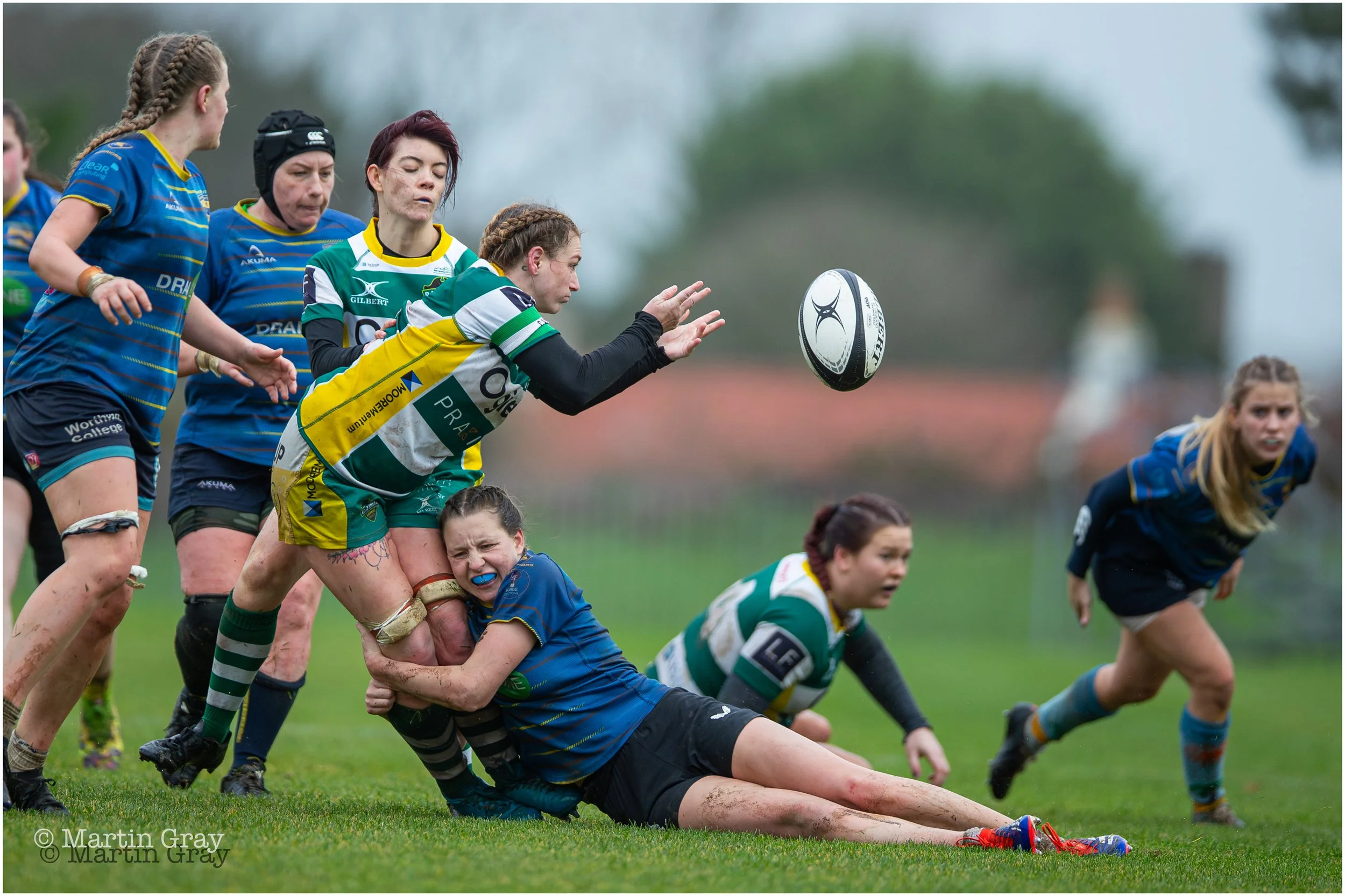 Kayleigh Oliver offloads a pass in tackle-6128.jpg