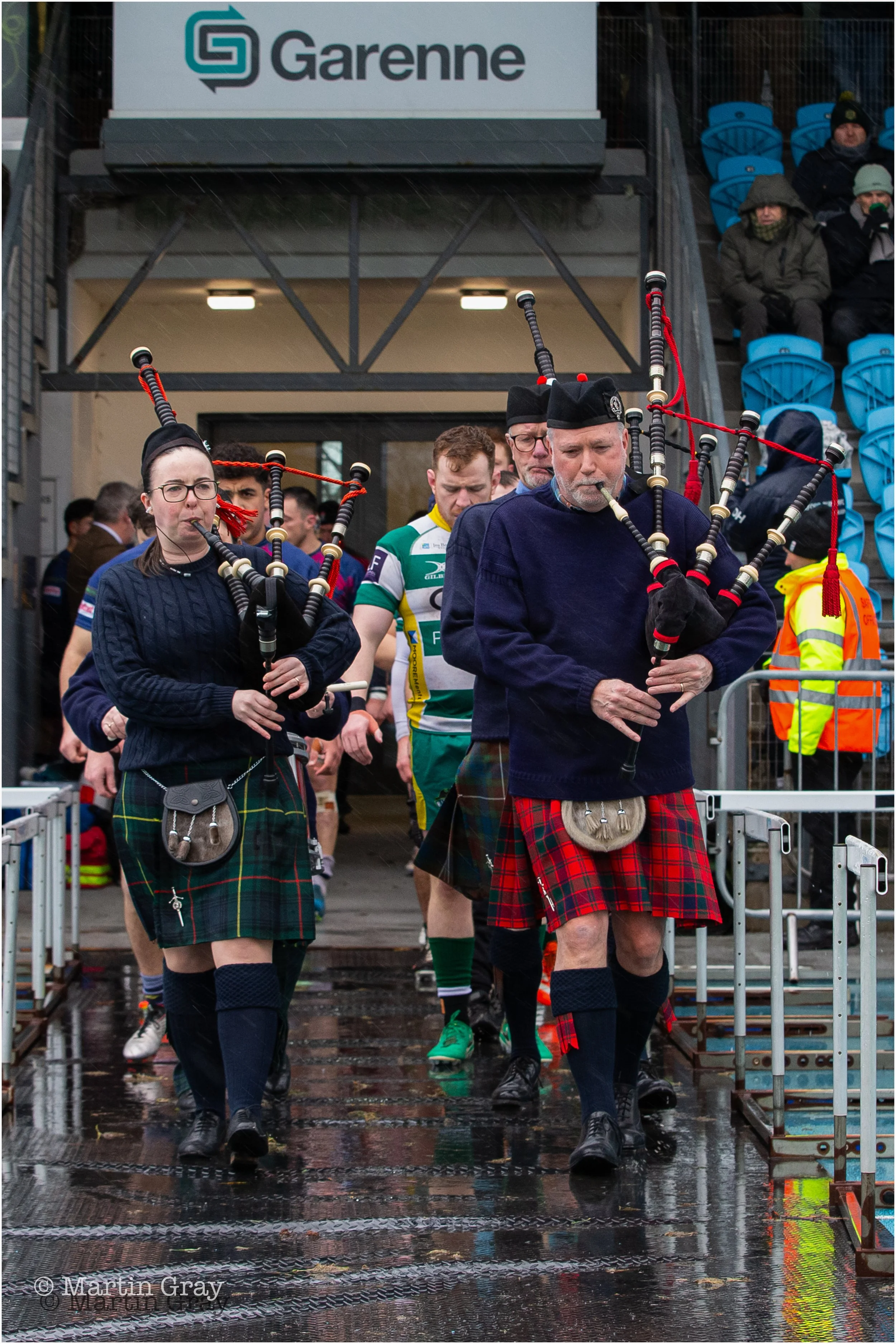 Bagpipes lead the two team onto the field-2.jpg