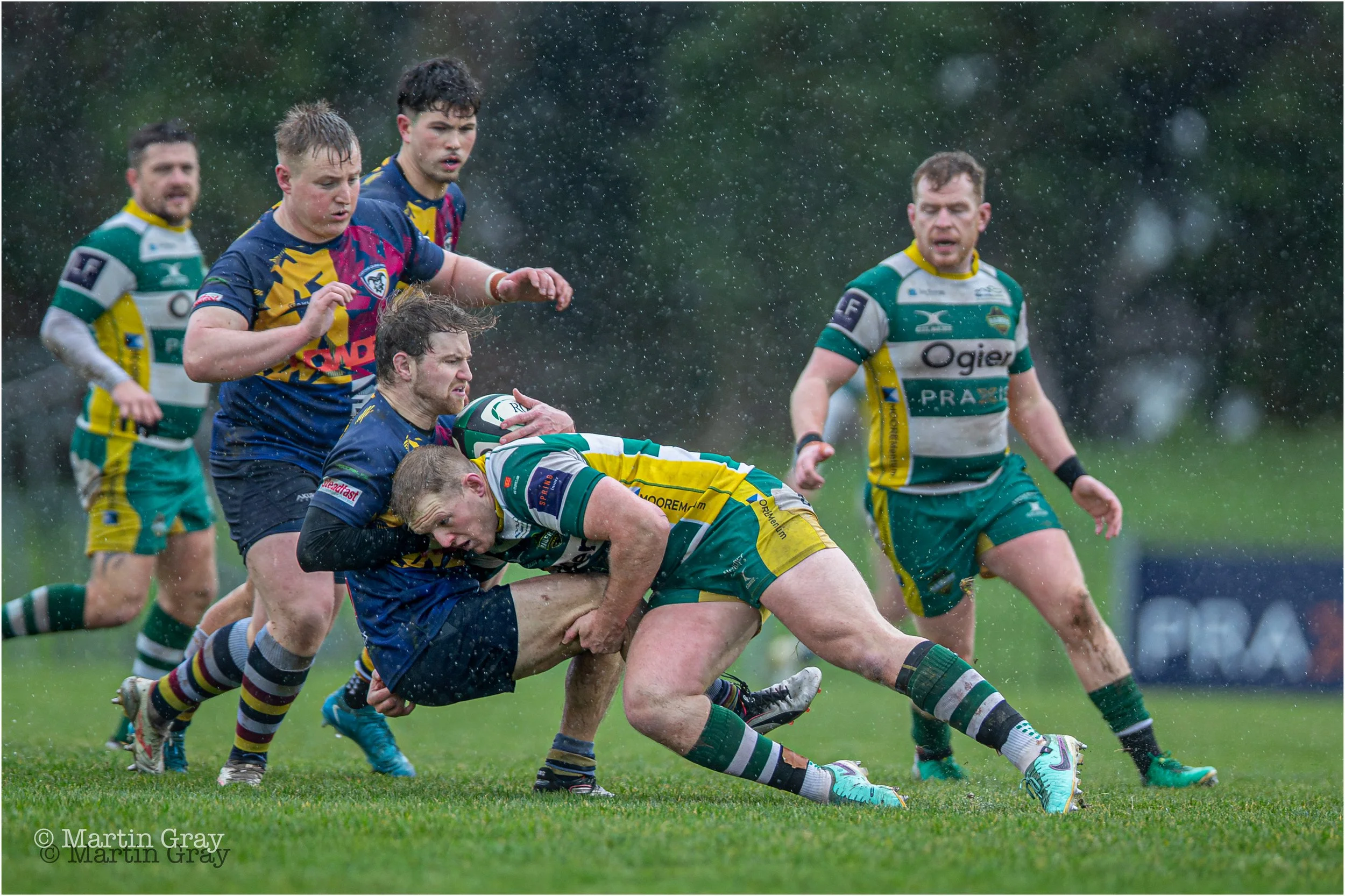 Ciaran McGann tackles in heavy rain-3242.jpg