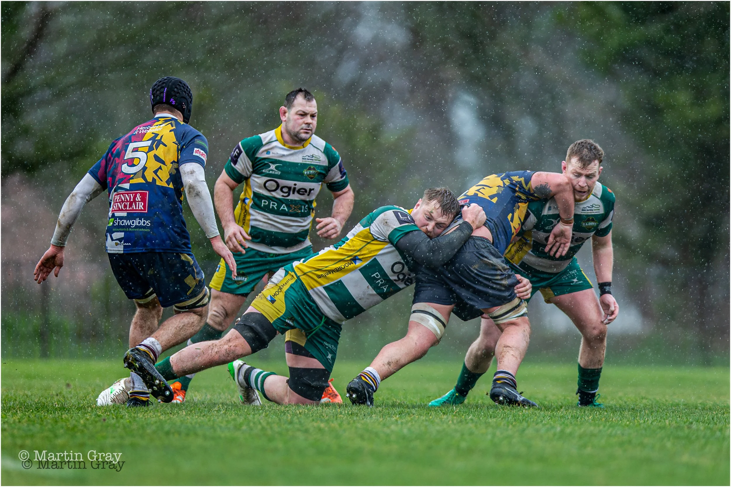 Hugo Culverhouse tackles in heavy rain-3264.jpg