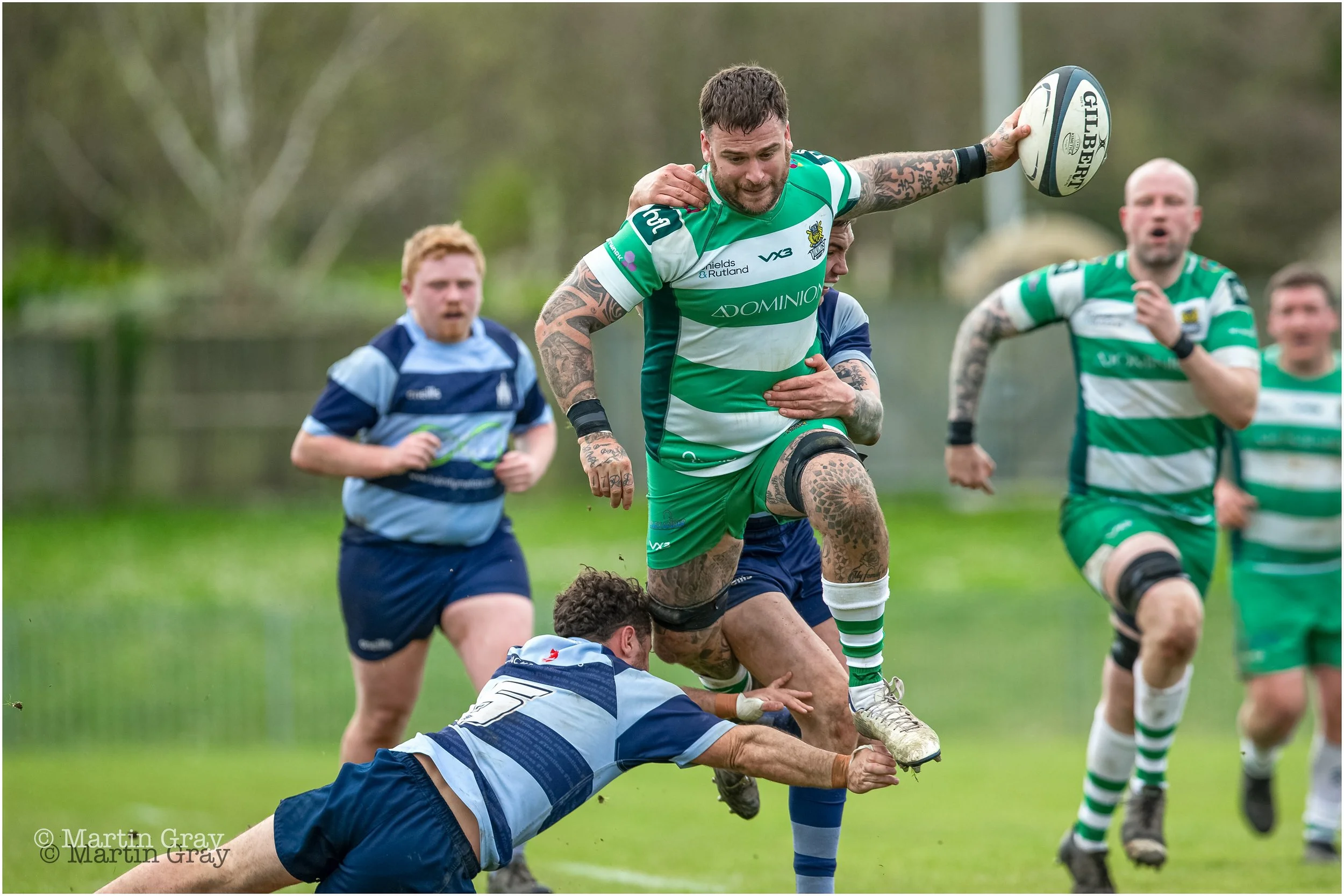 Tom Creed skips a tackle-1997.jpg