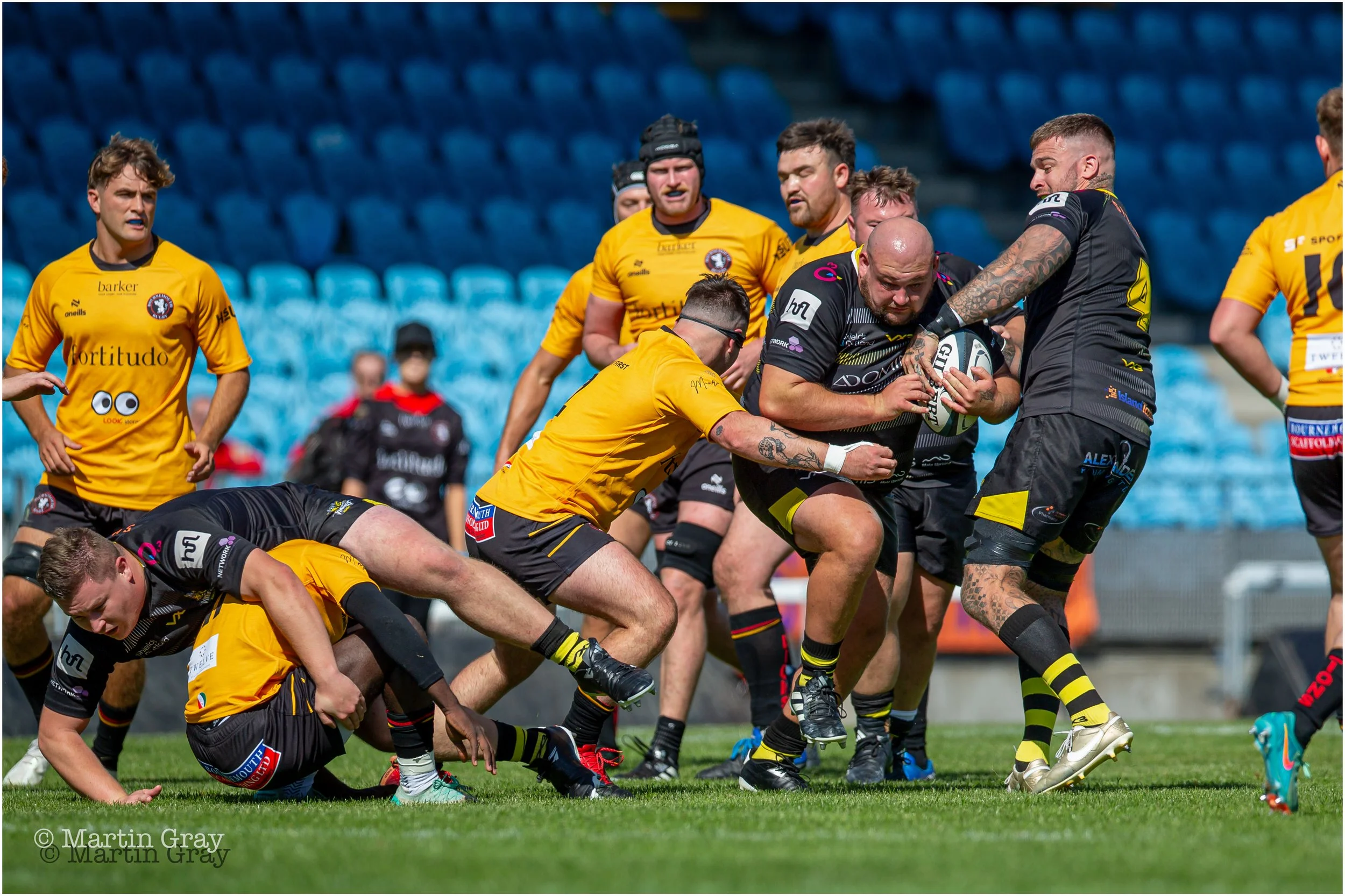 Corey Wallis breaks from a tackle-2656.jpg