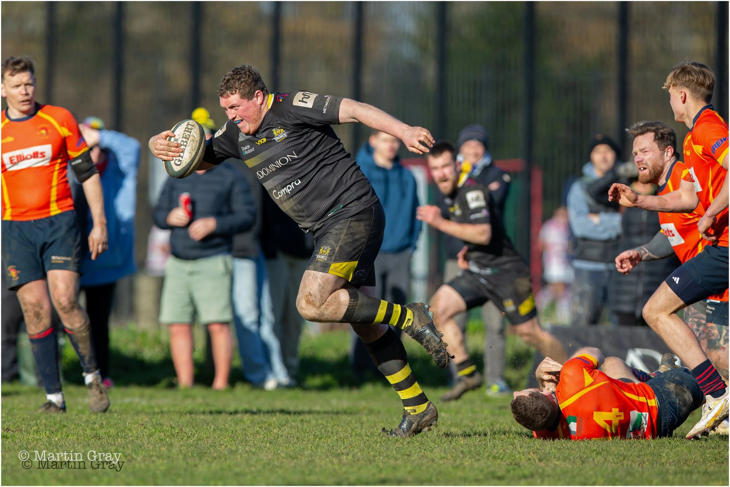Jacob Smith powers through a tackle-1693.jpg