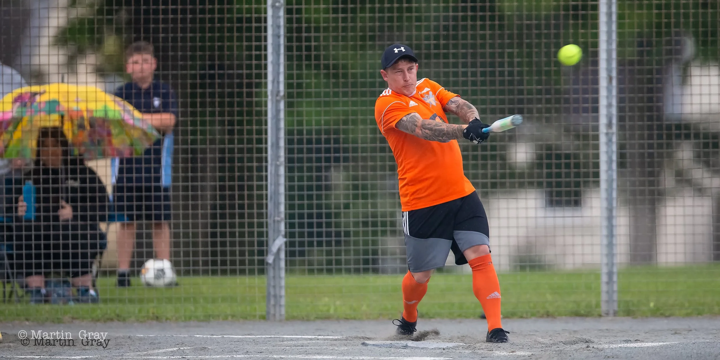 Ross Machon hits as the rain begins to fall-8078.jpg