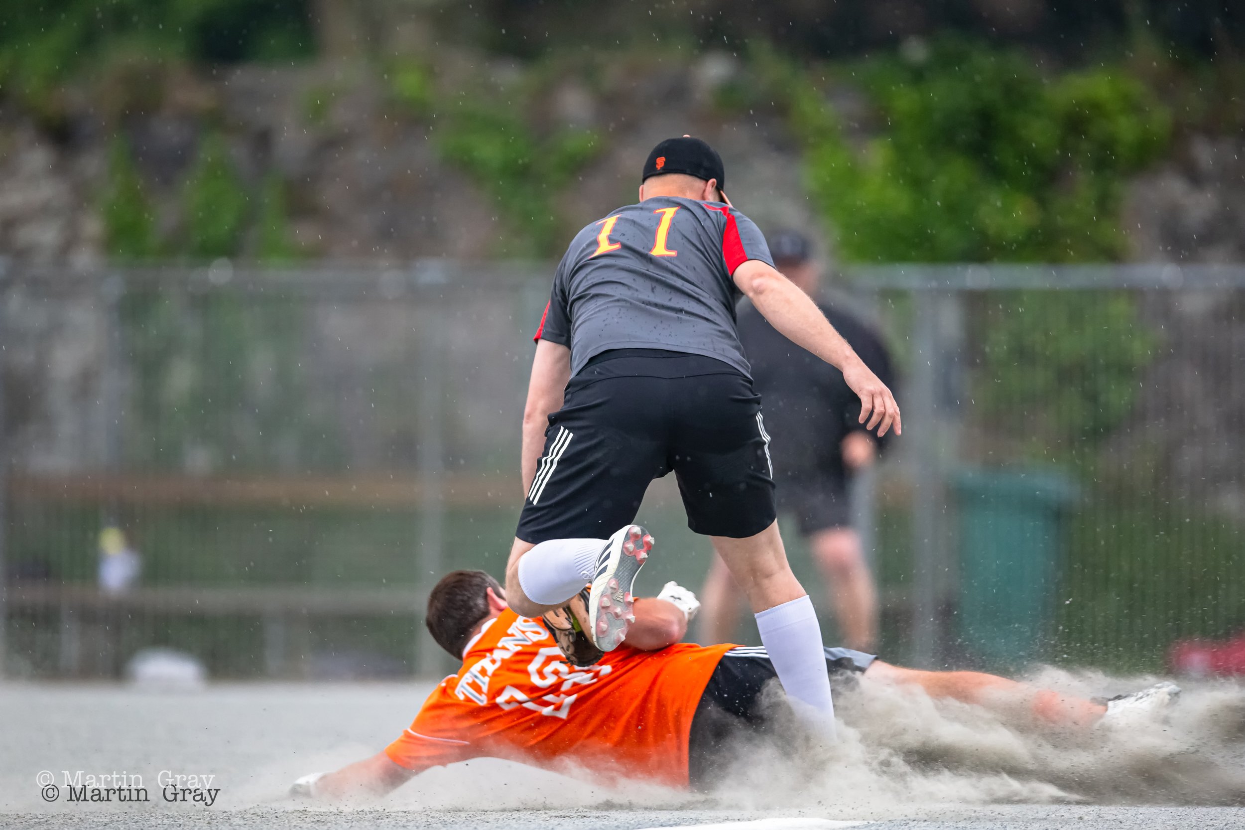 Titans Craig Batiste slides into 3rd with Spartans baseman Danny Penney-7992.jpg