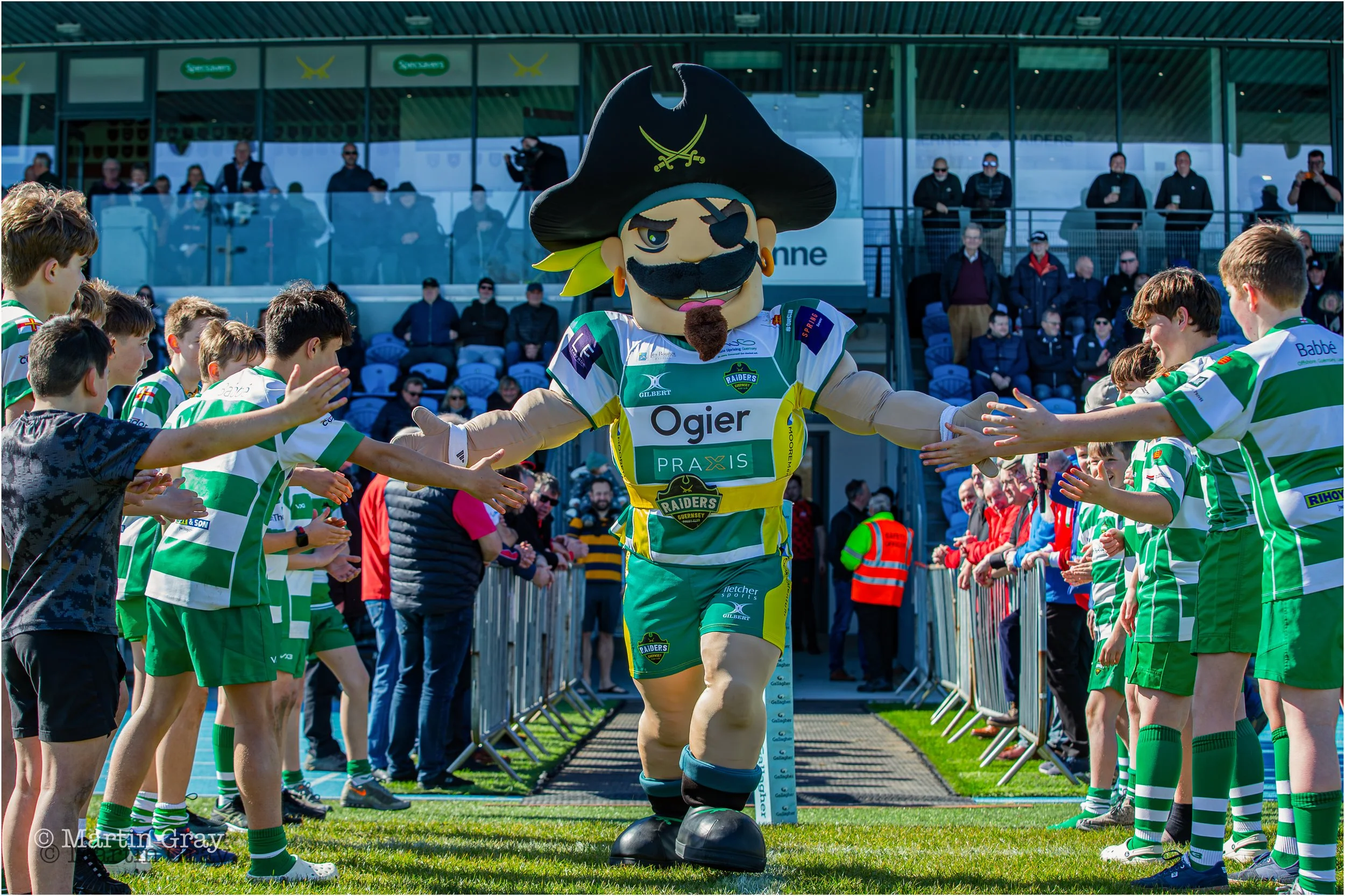 Rocky the Raider and Academy players lead out the teams-3881.jpg