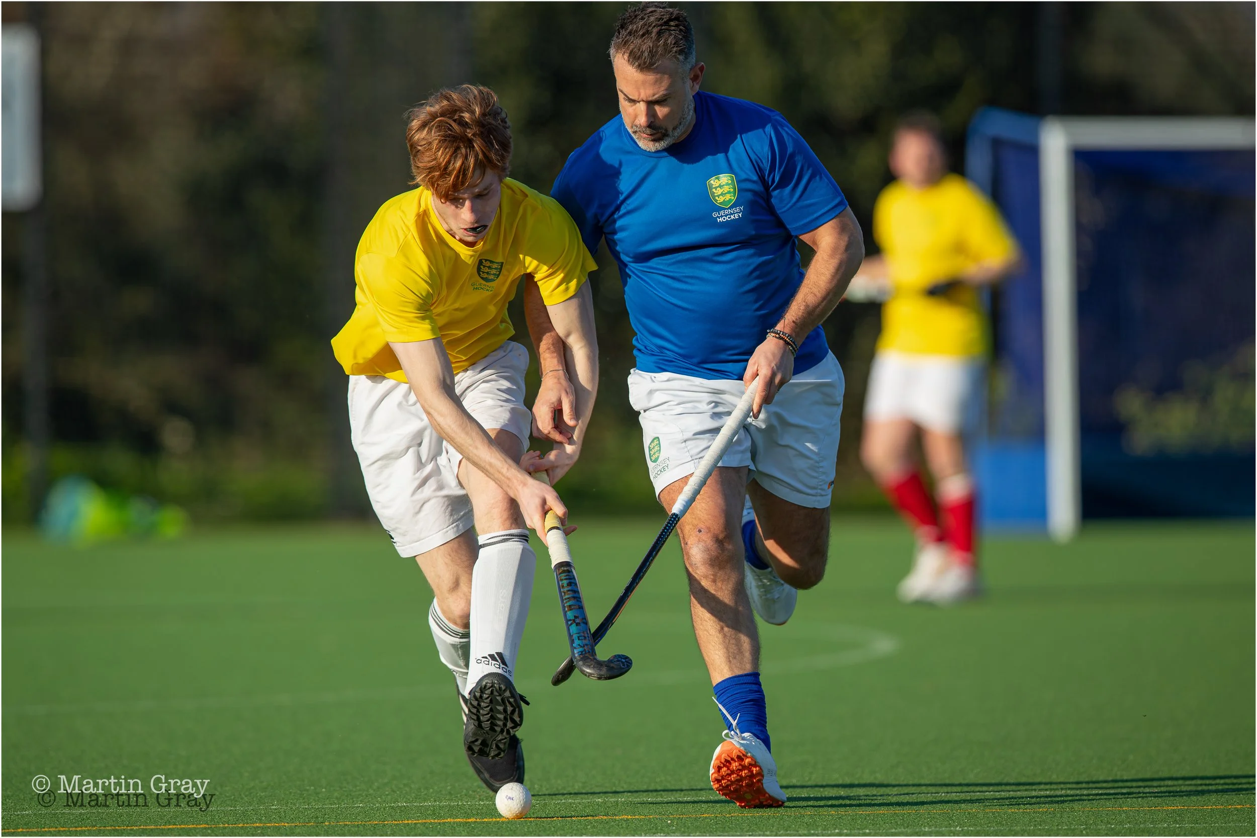 Max Culverwell and Rob Newton challenge for possession-9135.jpg