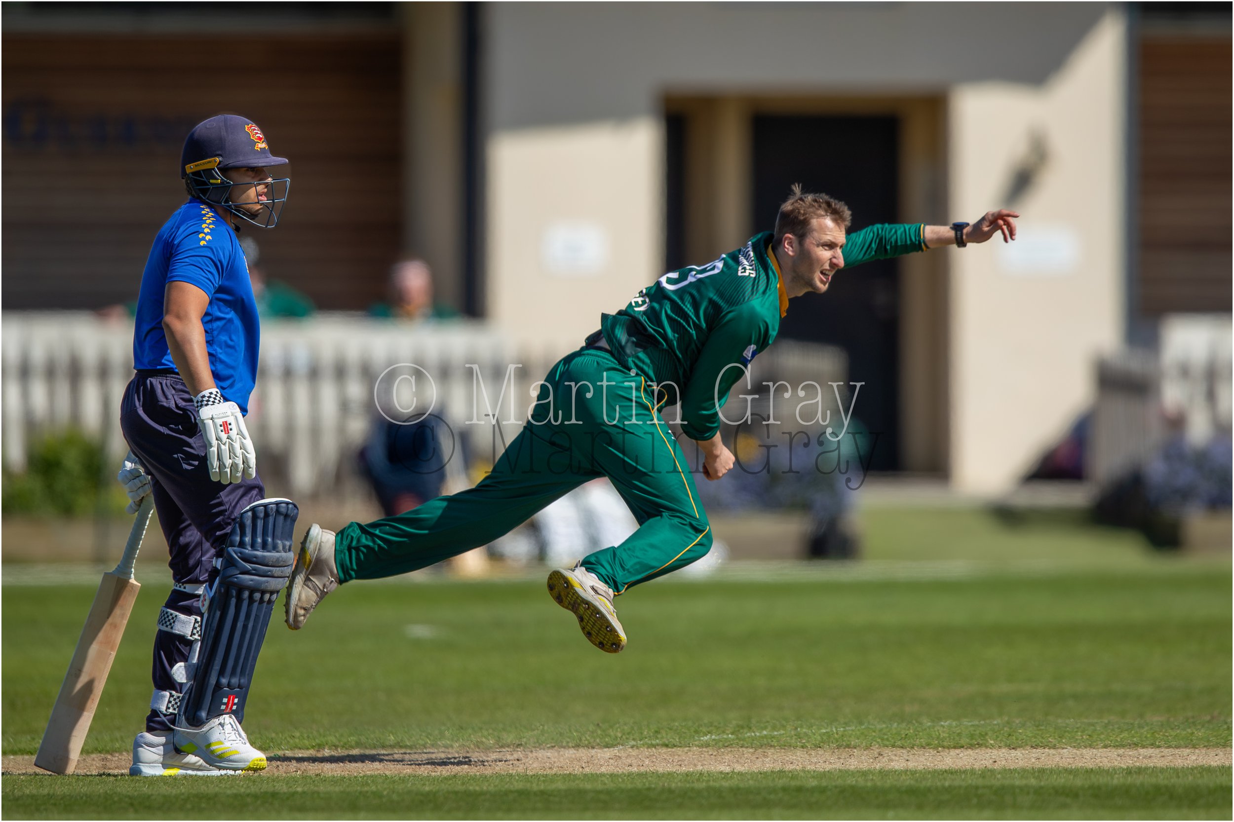 Matt Stokes bowling with Pavilion behind-4728.jpg