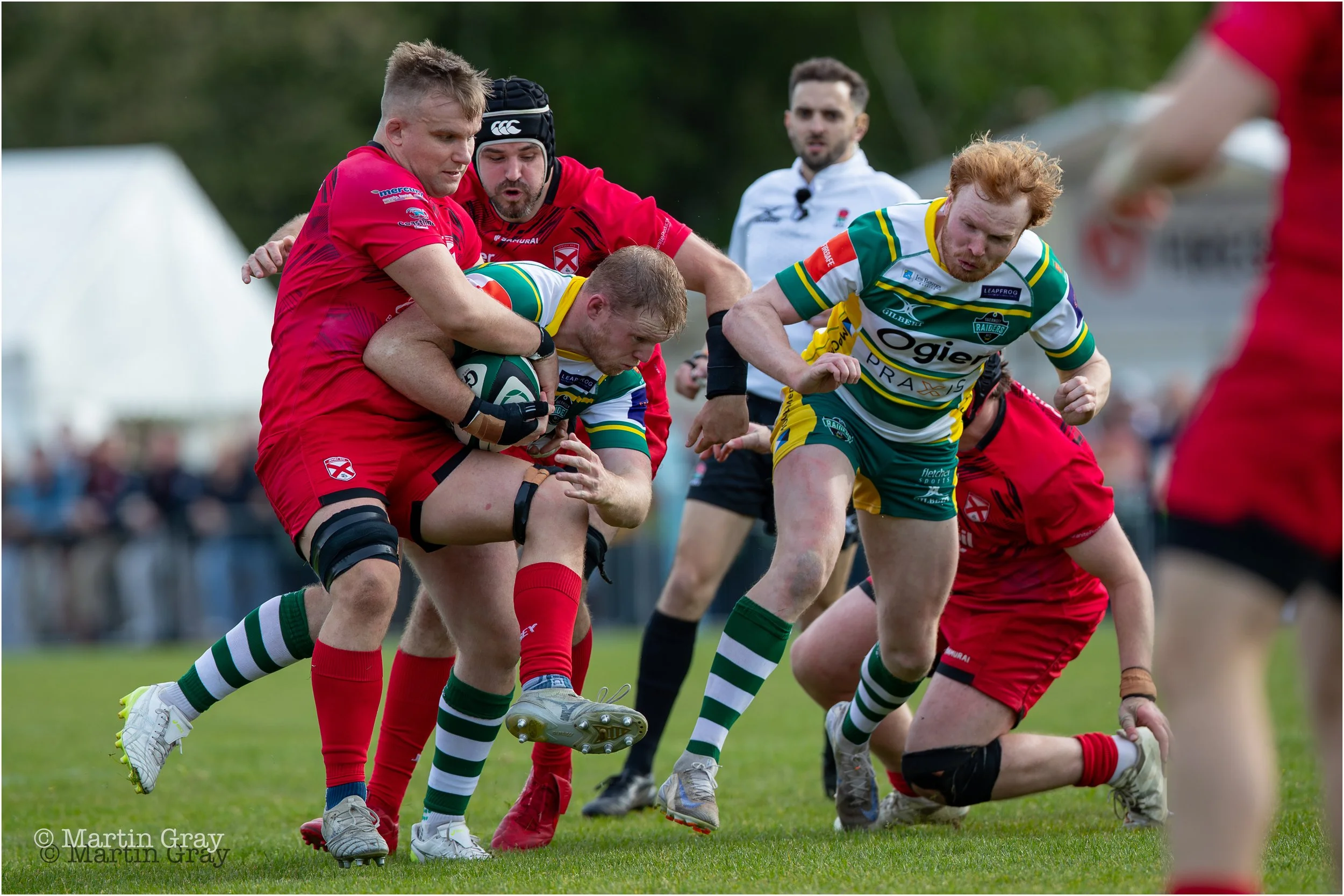 Ciaran McGann powers through a tackle attempt-6348.jpg
