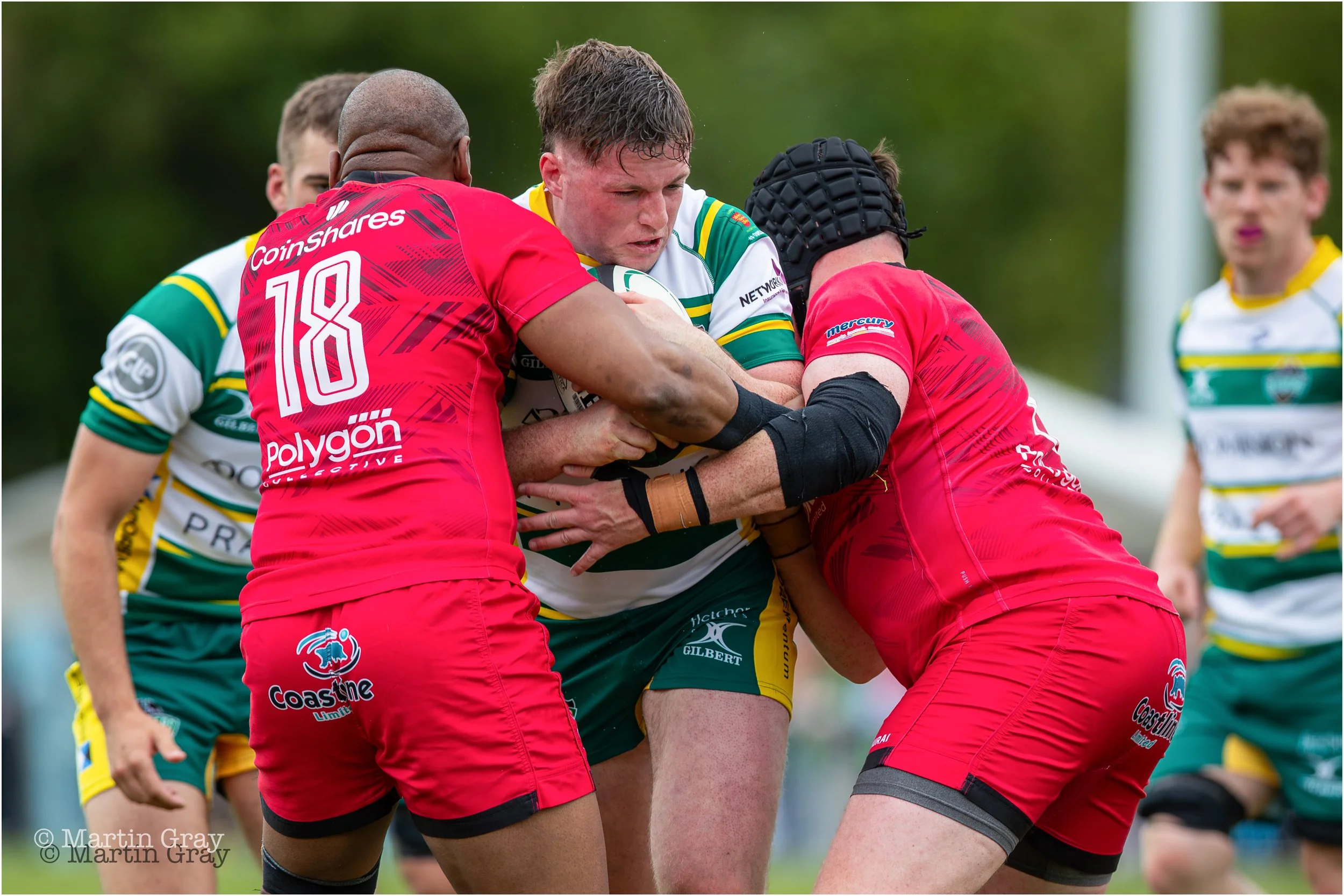 Niall McGann wrapped up in a tackle-4511.jpg