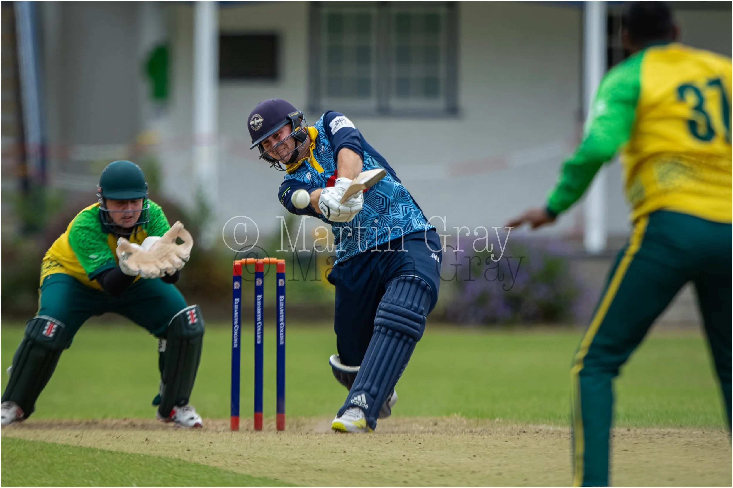 Josh Butler hits straight for a boundary-6149.jpg