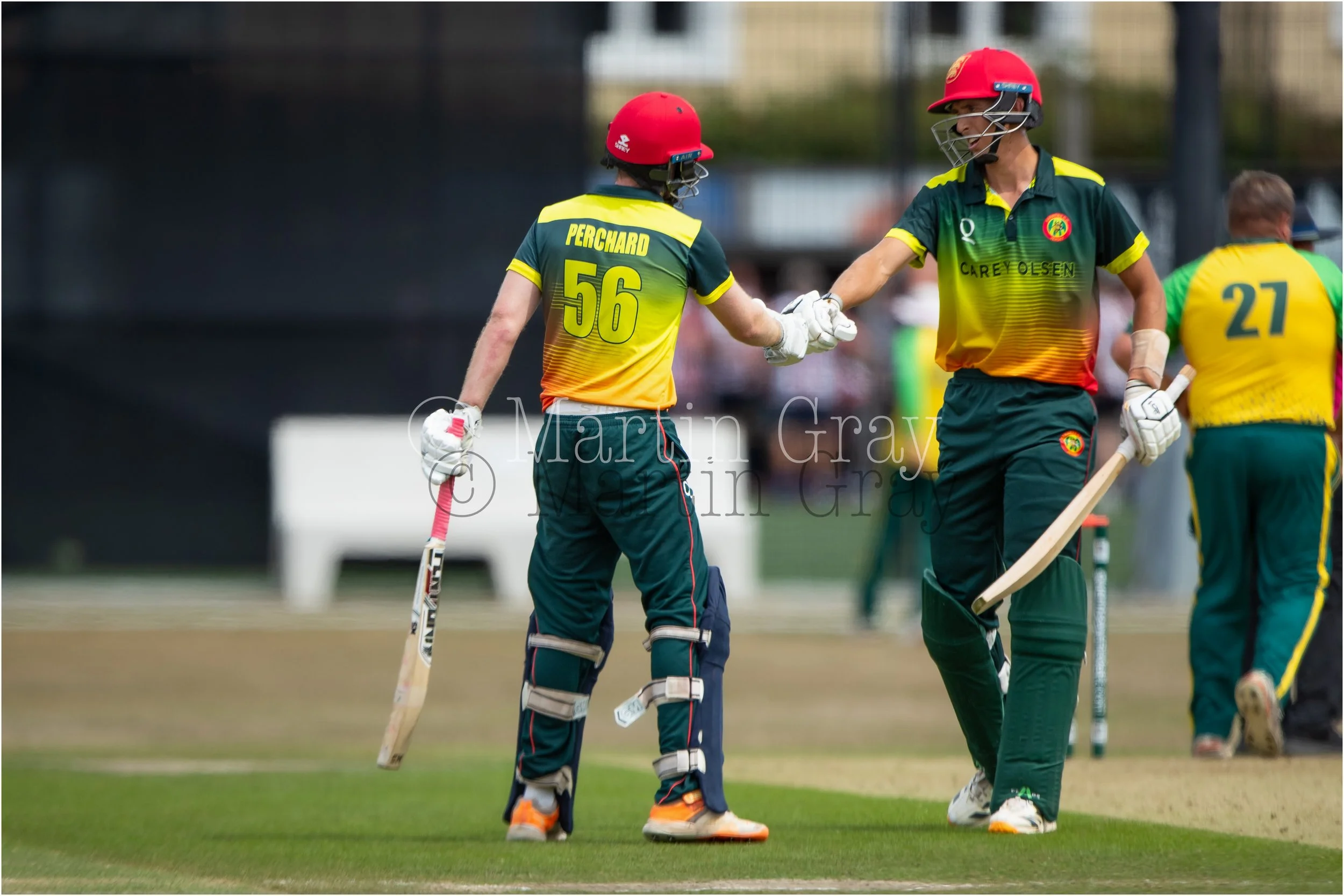Two Centurians Stan Norman and William Perchard fist pump in a stand of 194-3943.jpg