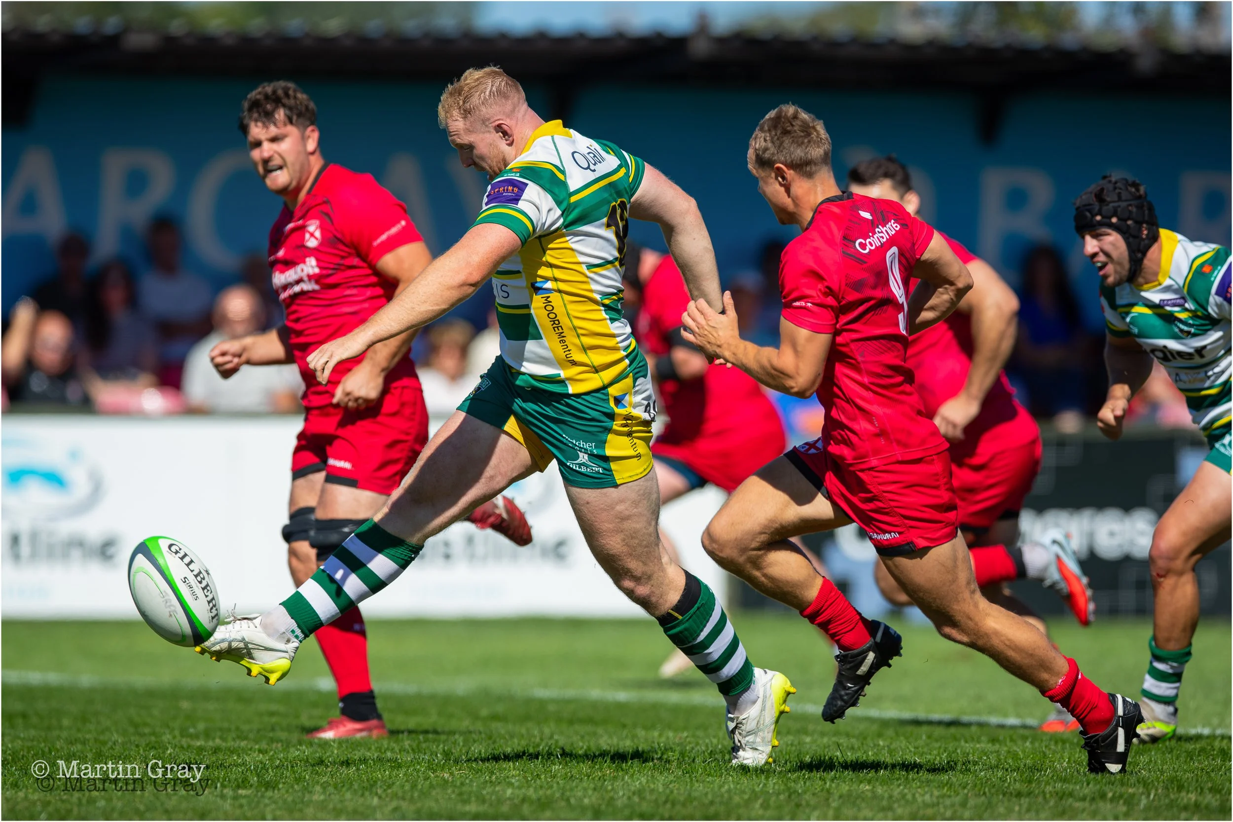 Ciaran McGann kicks to create pressure on Jersey-7524.jpg