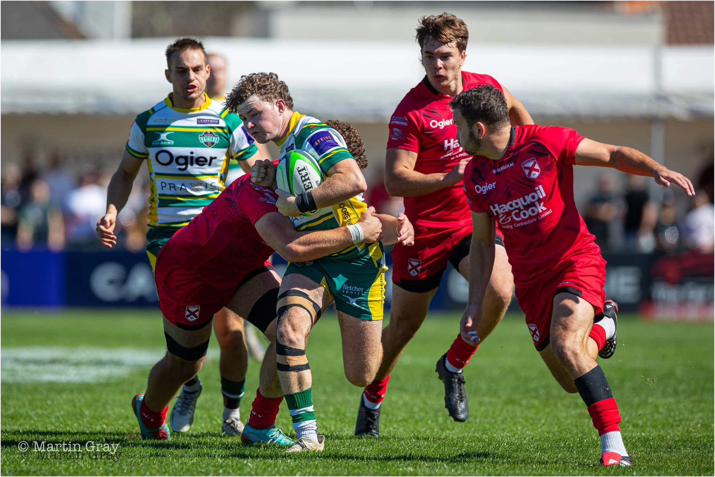 Ozzie Kent powers into a tackle-7432.jpg