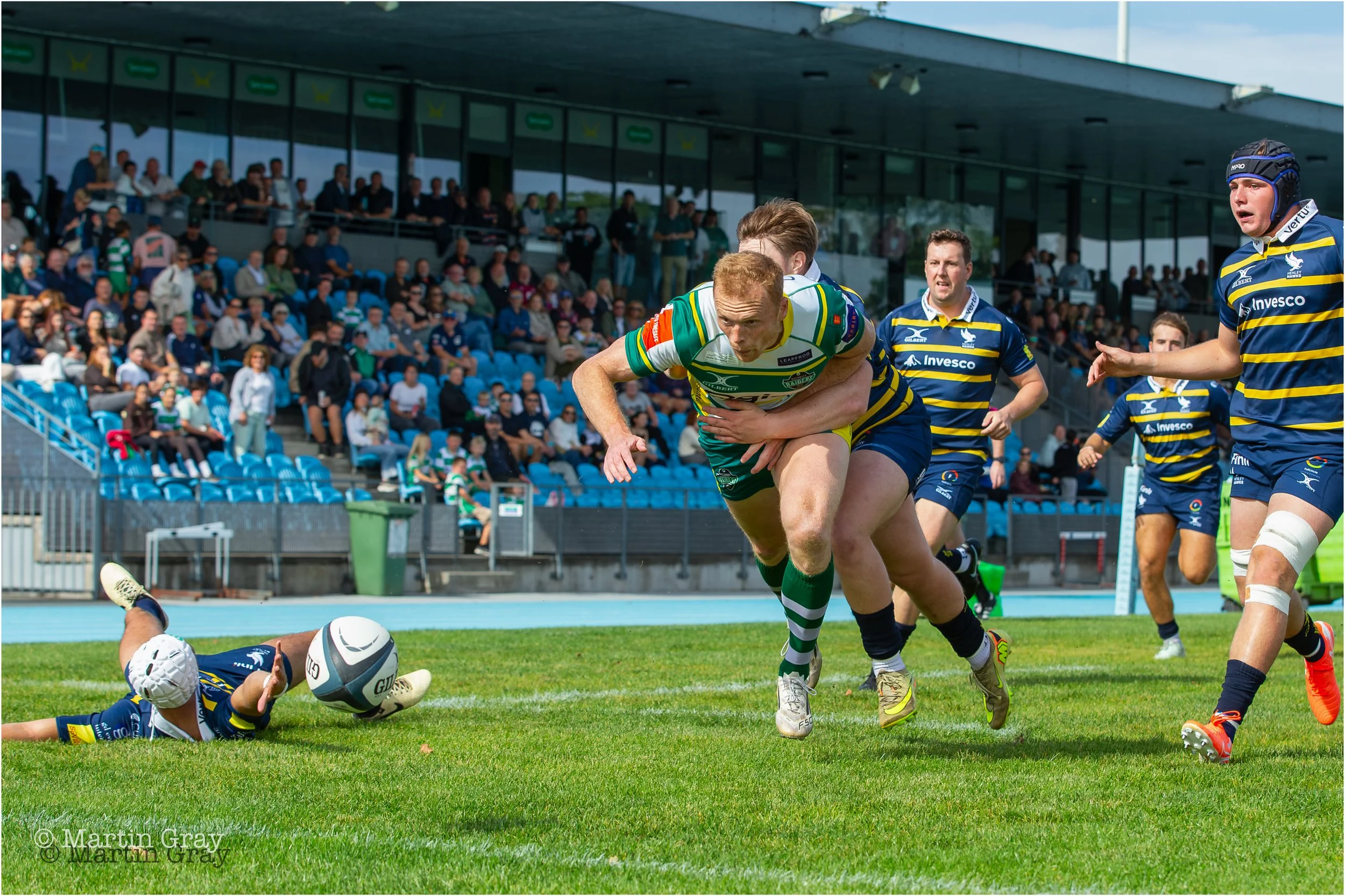 Anthony Armstrong chasing down a kick early in first half-1394.jpg