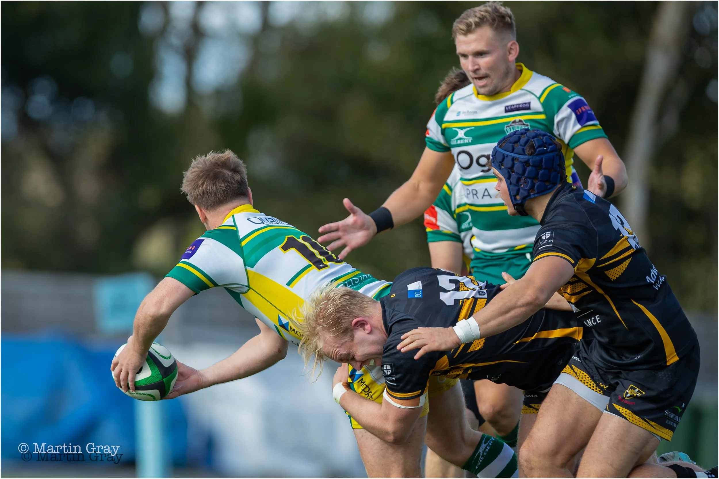 Gwyn Parks offloads a pass under a tackle-2742.jpg
