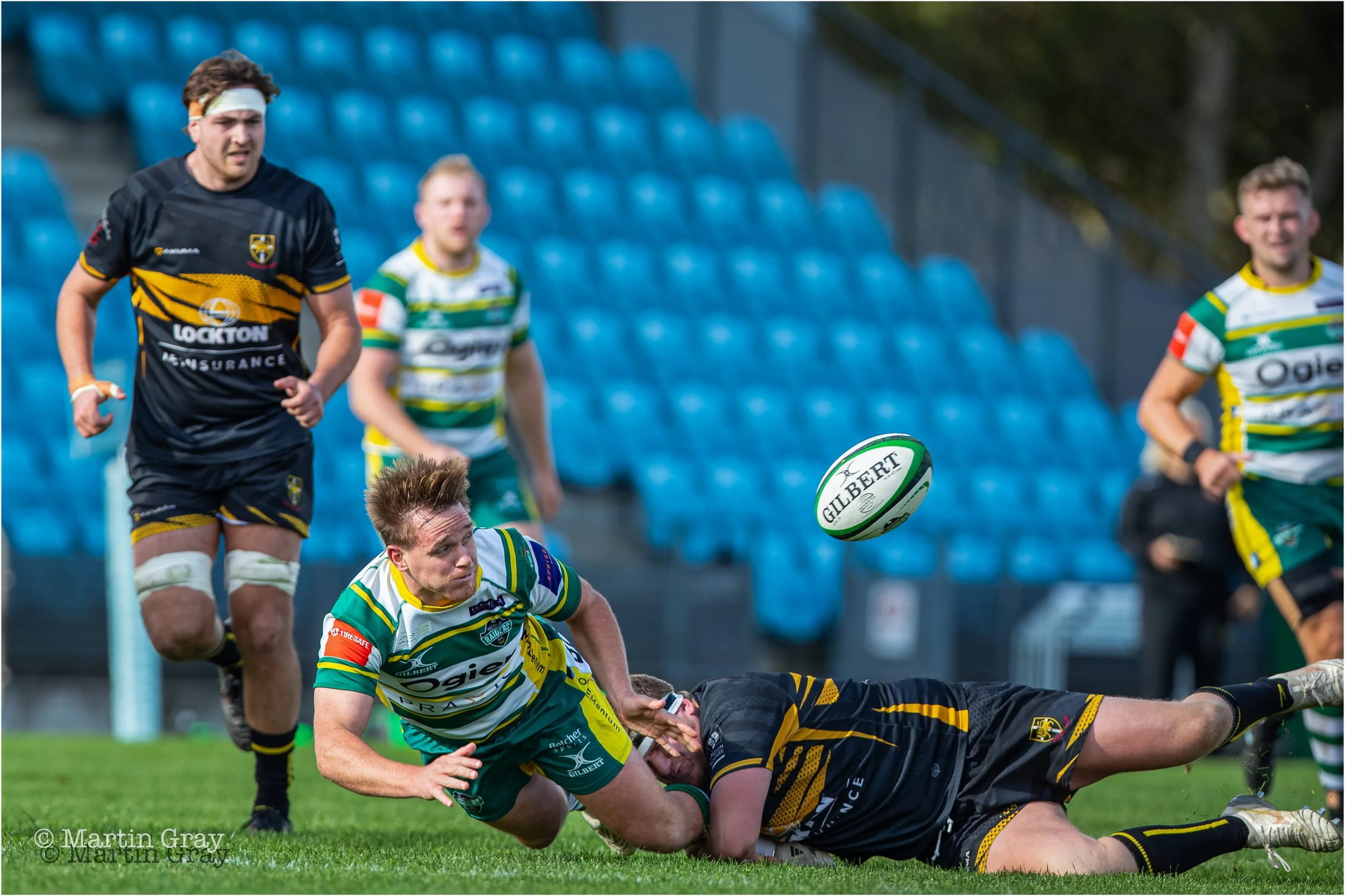 Gwyn Parks offloads a pass under a tackle-3028.jpg