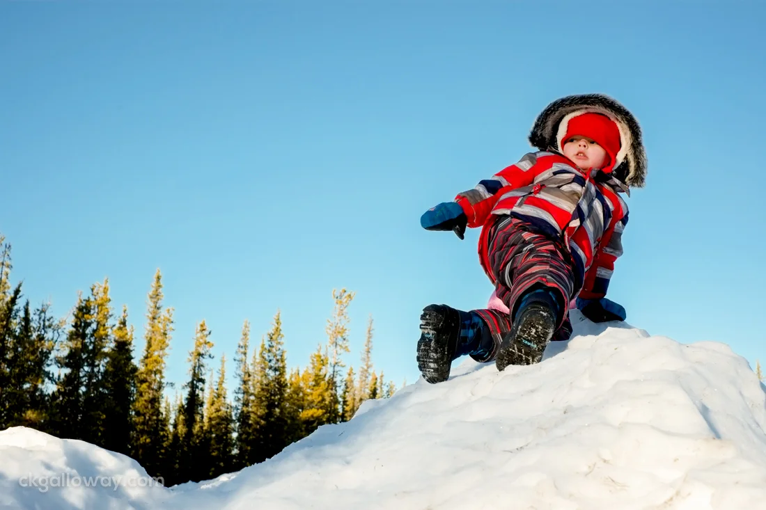Oscar climbing the snow hill at Lorne Mountain Community Centre. At one point he stood wobbling at the top of the hill, jumped in the air as high as he could, and slid down to the sound of gasps from onlookers.