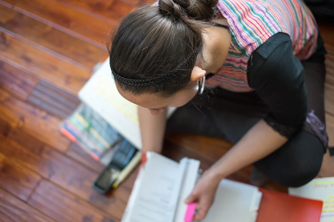 Erin Sanderson studies the FAM (flight attendant manual). Photo by Christa Galloway.
