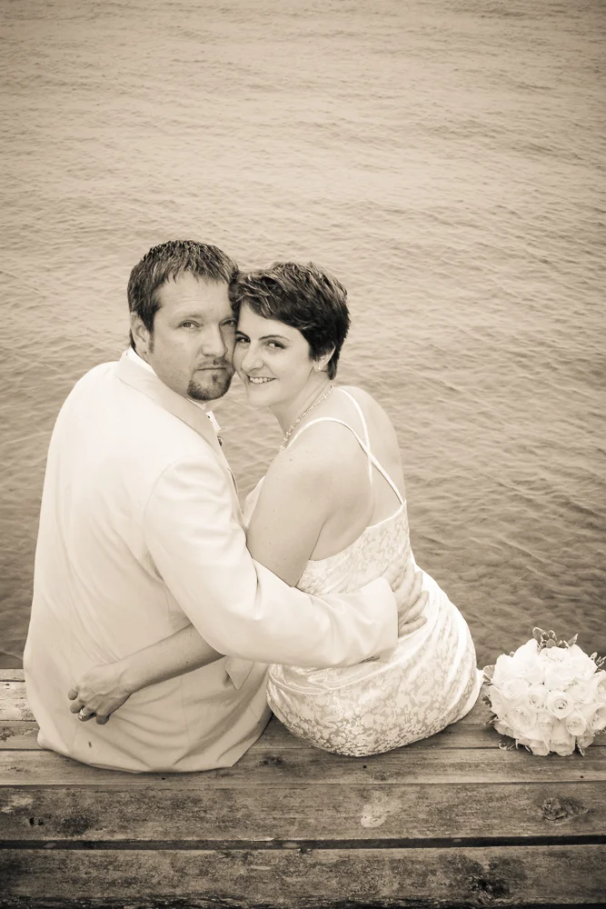 Richard and I sitting on the dock on our wedding day. Photo by Simon Furlong.