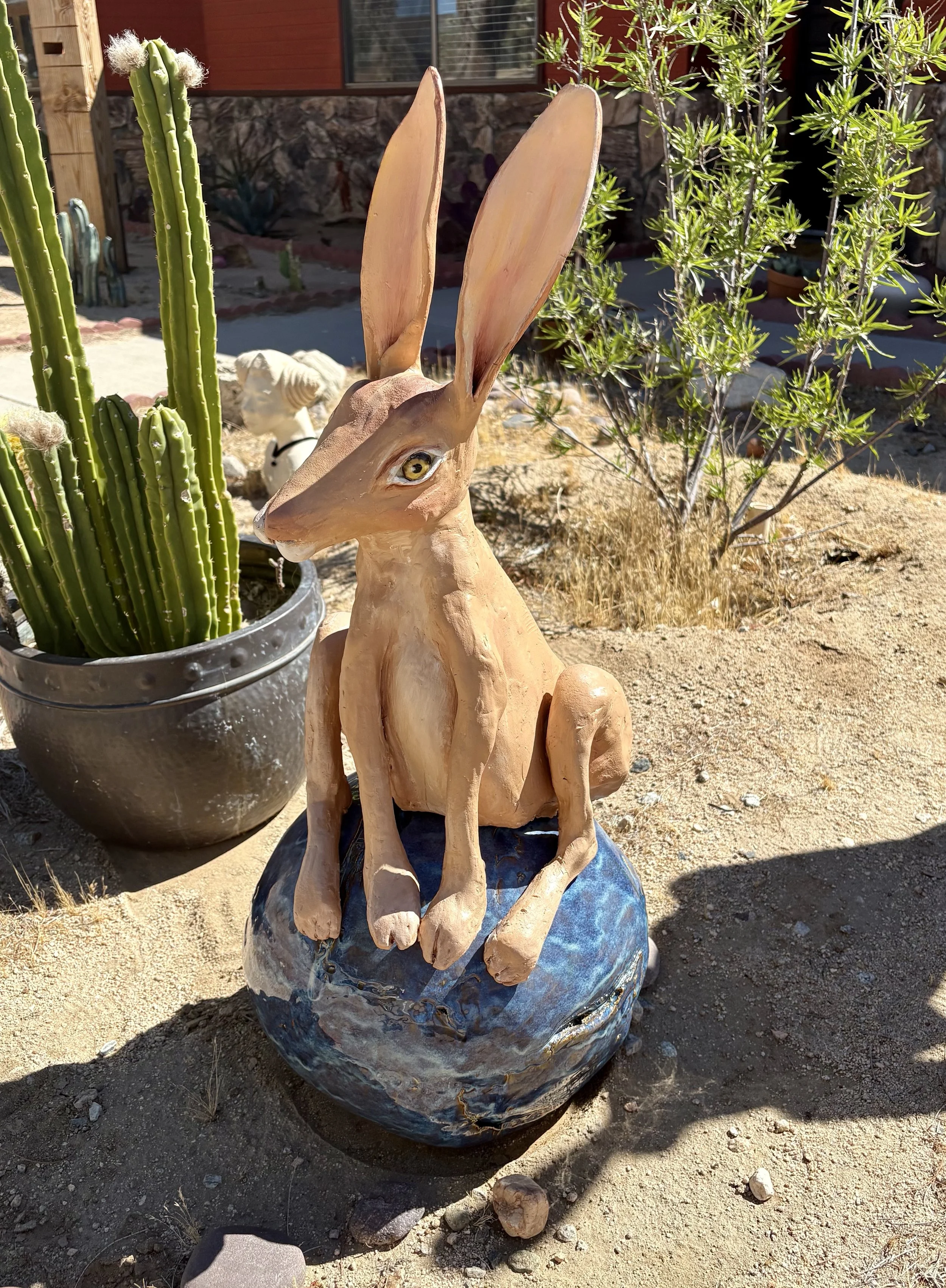 HARE SITTING ON THE WORLD