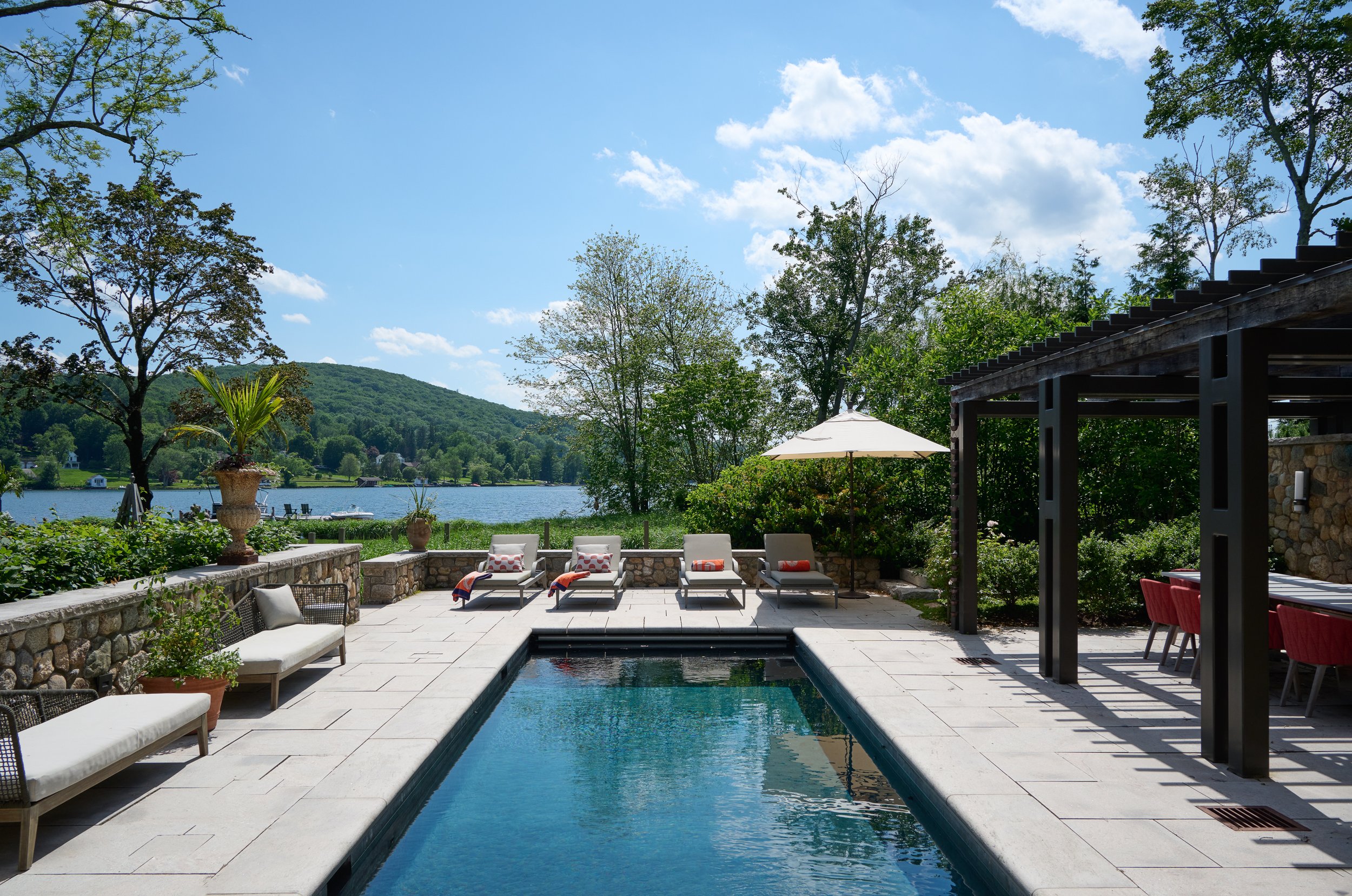  pool area with sun chaises, dining and outdoor kitchen 