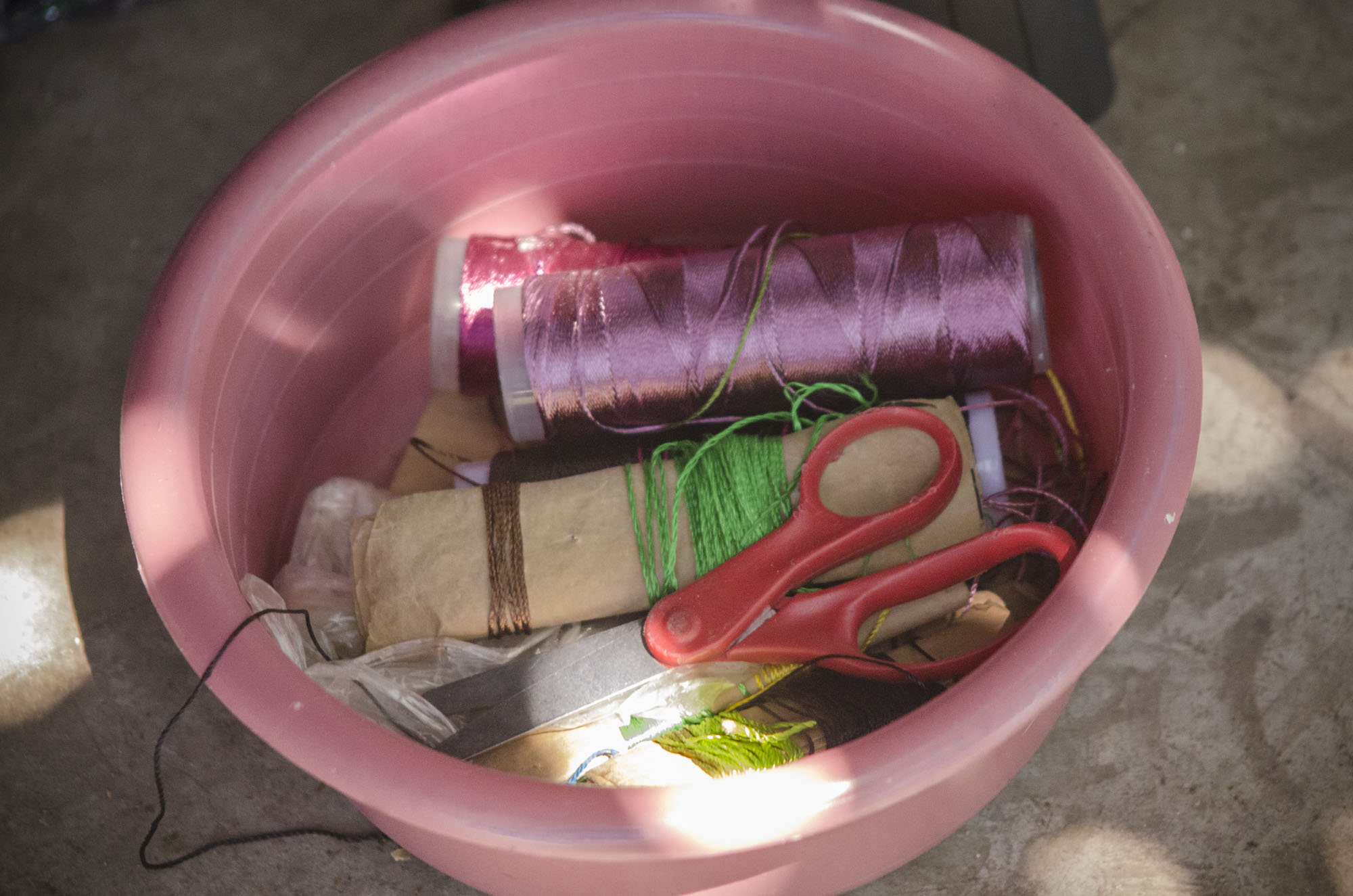 Bin of embroidery tools