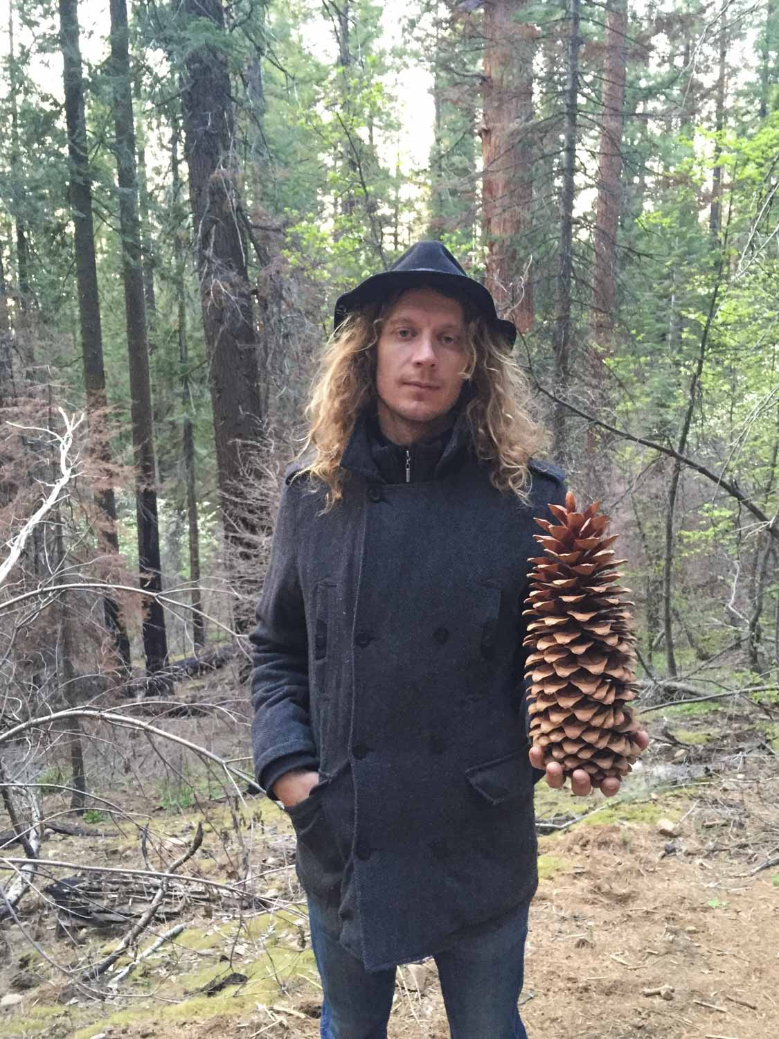 Matty holding a Red Wood Tree pine cone