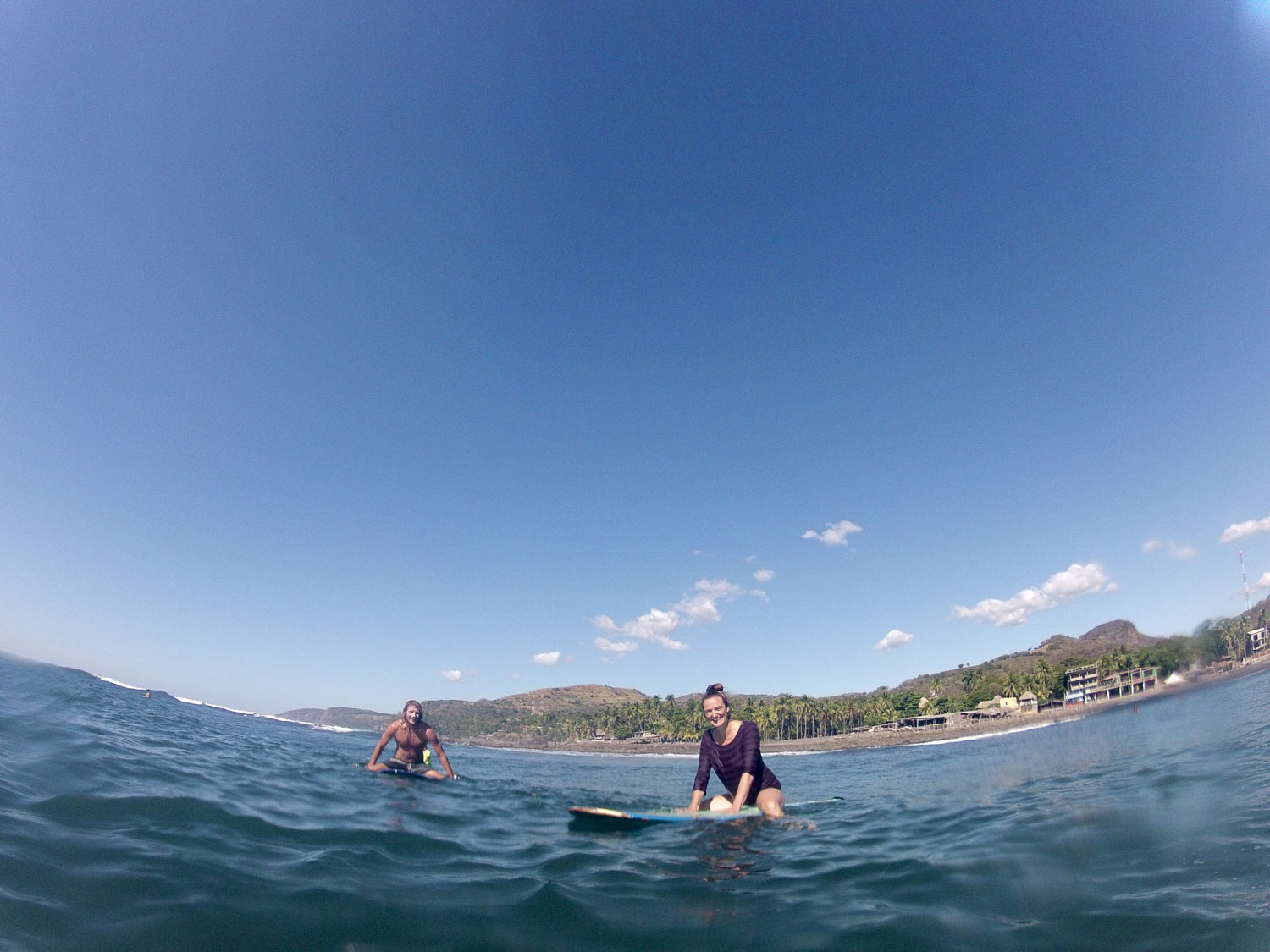 Matty and Saskia waiting for a wave