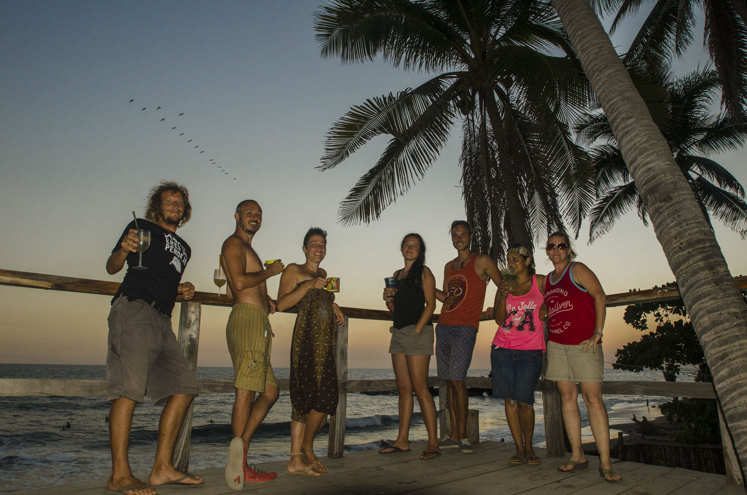 Left to right: Matty, John, Mandi, Stefy, Kai, Sunny and Karen enjoying classic sunset cocktails