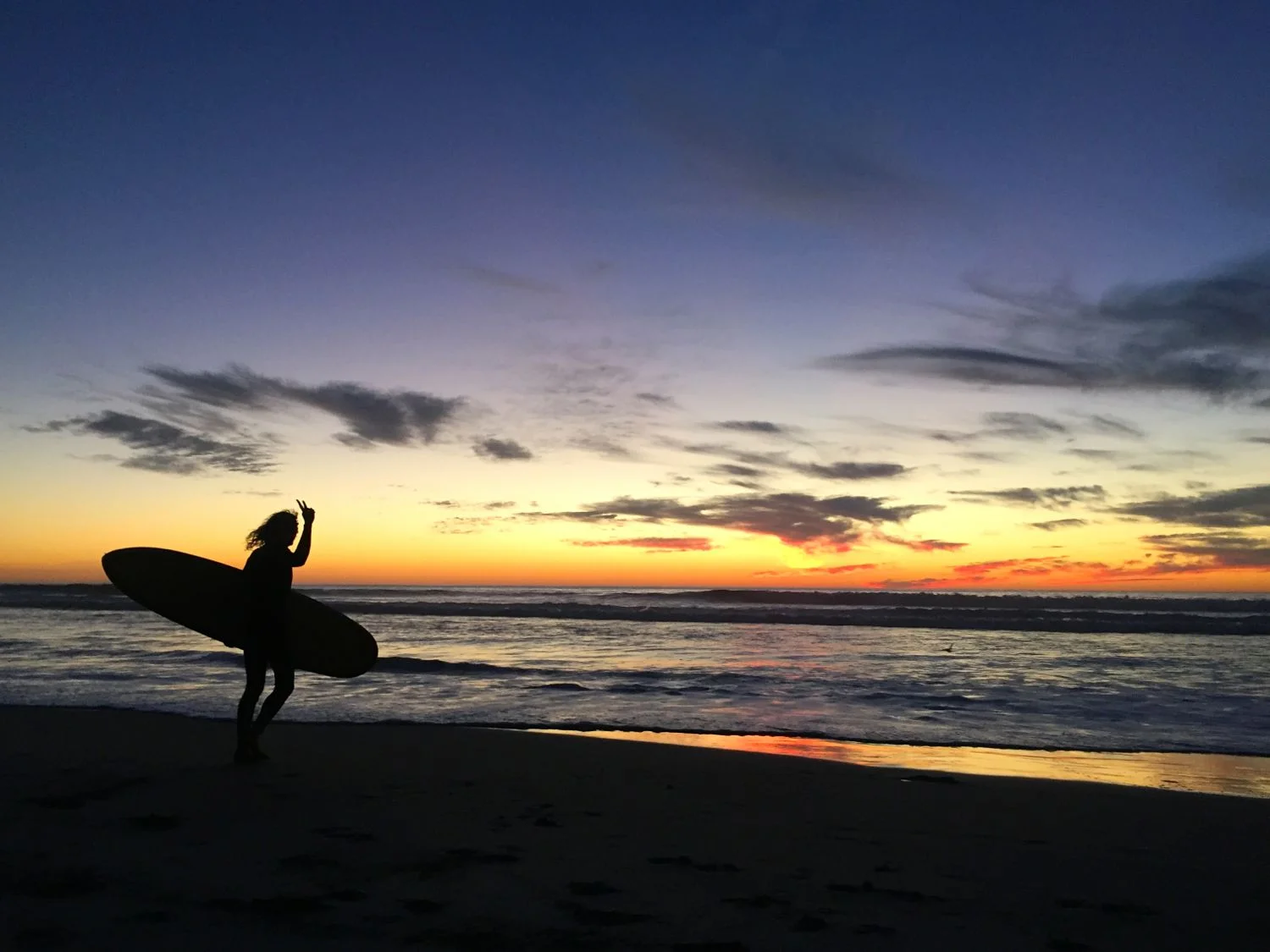 Surfing La Mision at sunset