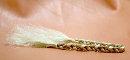 human and plastic braided together - on leather