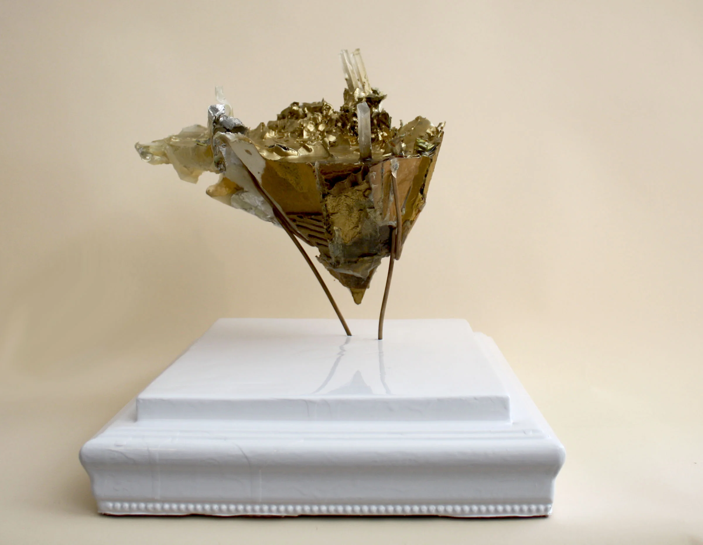 Object #3 Debris and Refuse Cast in Eco-Resin, Gold Spray Paint, Wood Glue, Plaster, Used Cardboard, White Sign Painters' Enamel and Used Wood Framing 11" x 15" x 10" 2012-13 Side View