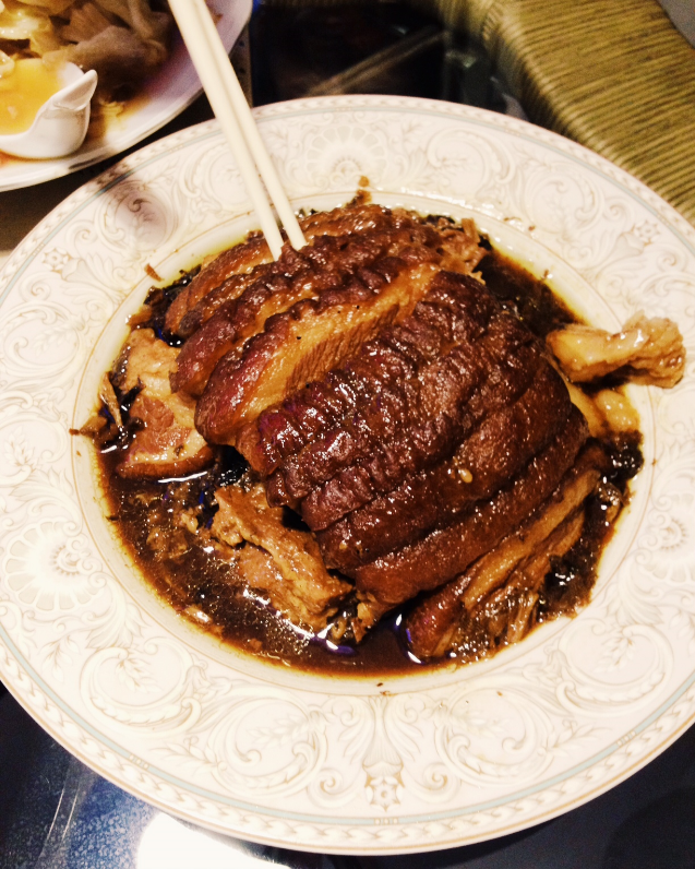 Po-Po's Mei Gan Kou Rou, braised pork belly that's both perfectly sweet and salty.