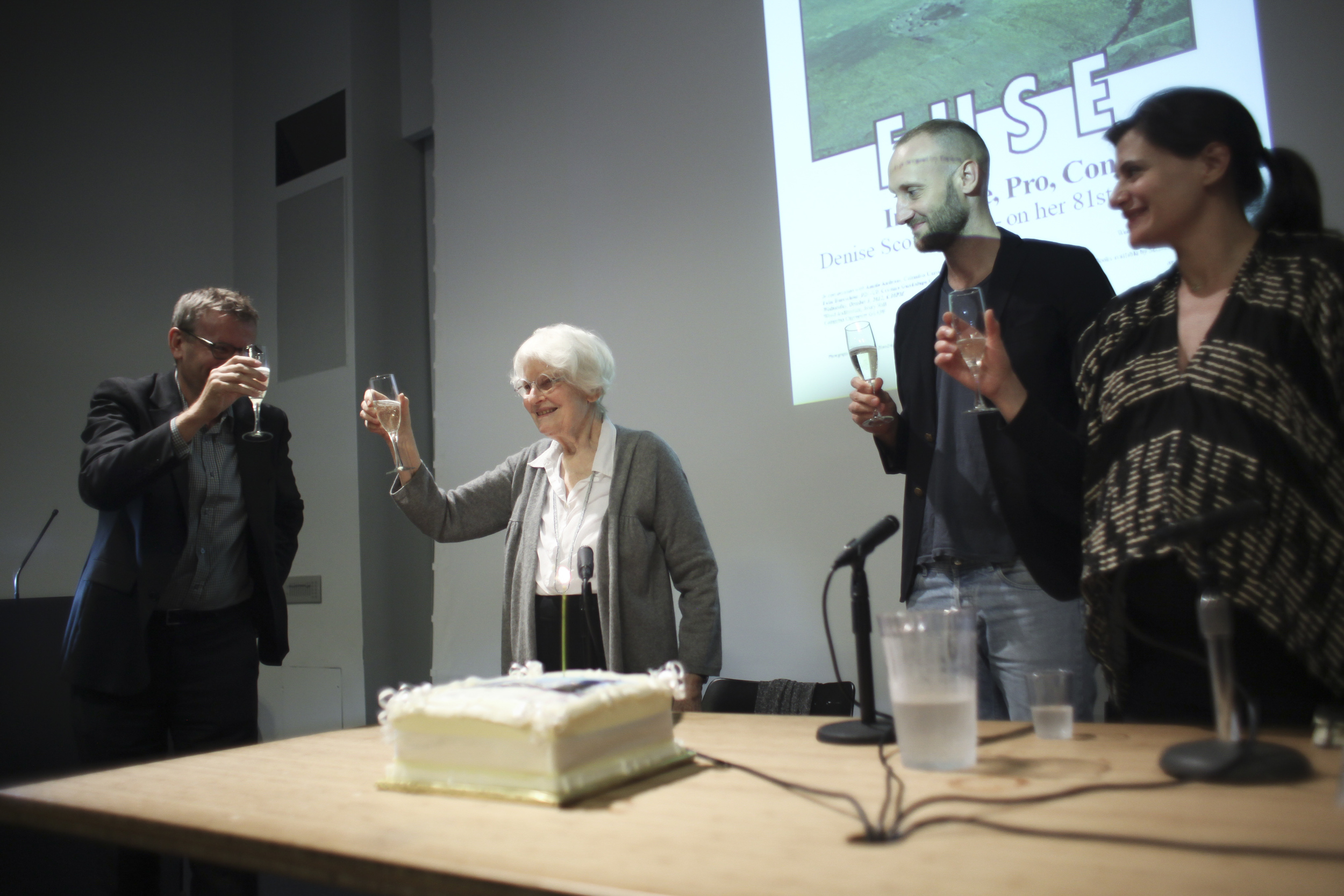  Denise Scott Brown is toasted by Mark Wigley, Felix Burrichter, and Amale Andraos on her 81st birthday. October 3, 2012, Wood Auditorium, Columbia University.  