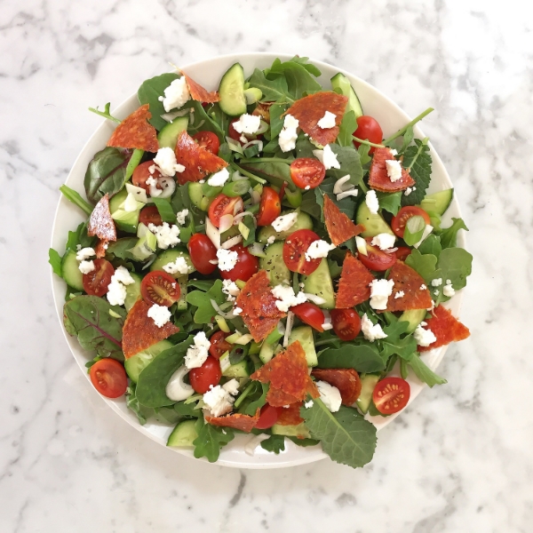 Pizza Salad - Pepperoni (from humanely raised pork) tomatoes, cucumbers, green onion, feta cheese, arugula and baby greens. Oh man - I just thought of adding olives to this delight...