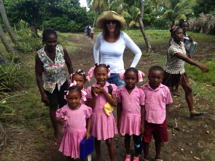 Alex with school children in Haiti 2014