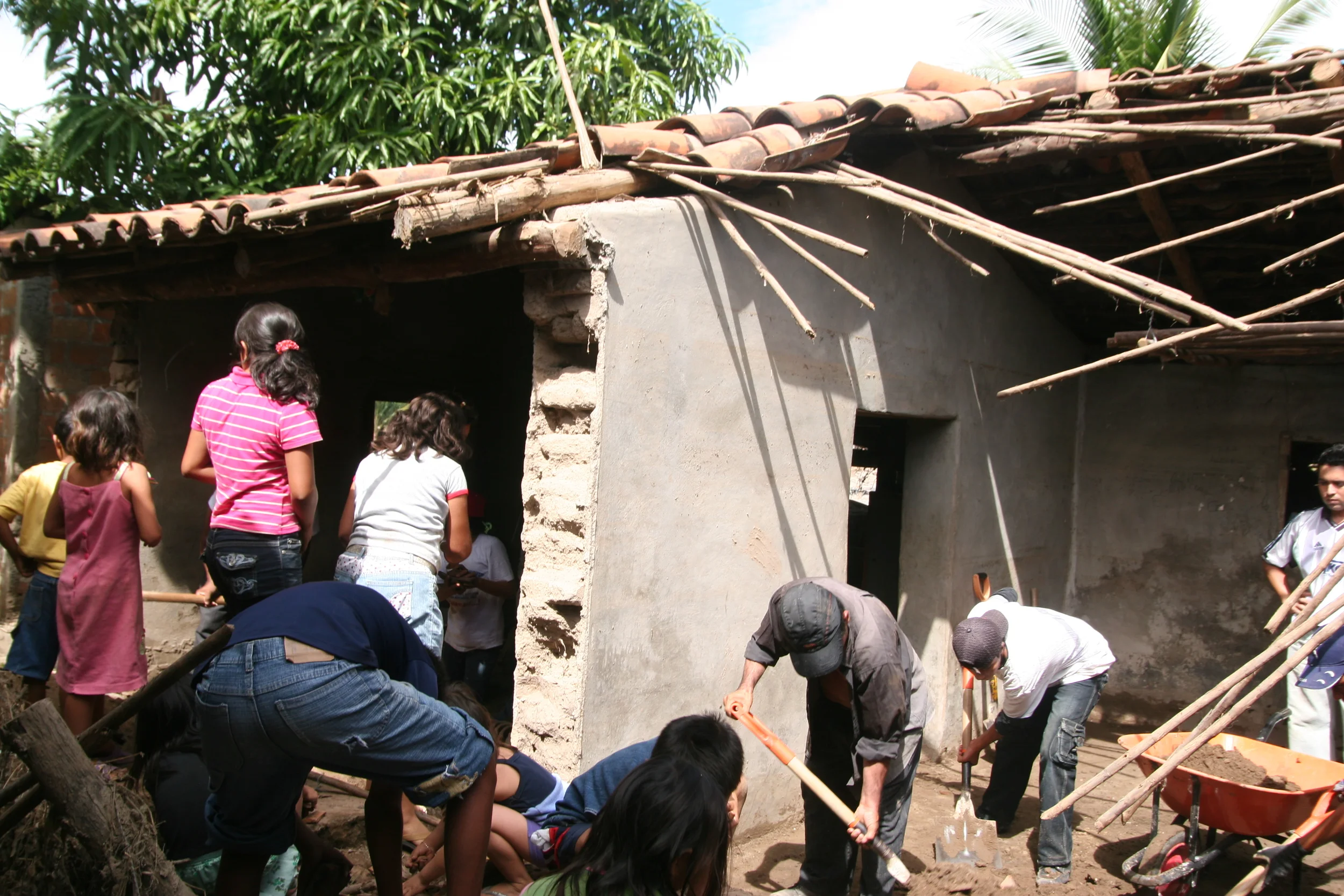 Volunteers removing sand from a home in Santa Cruz.
