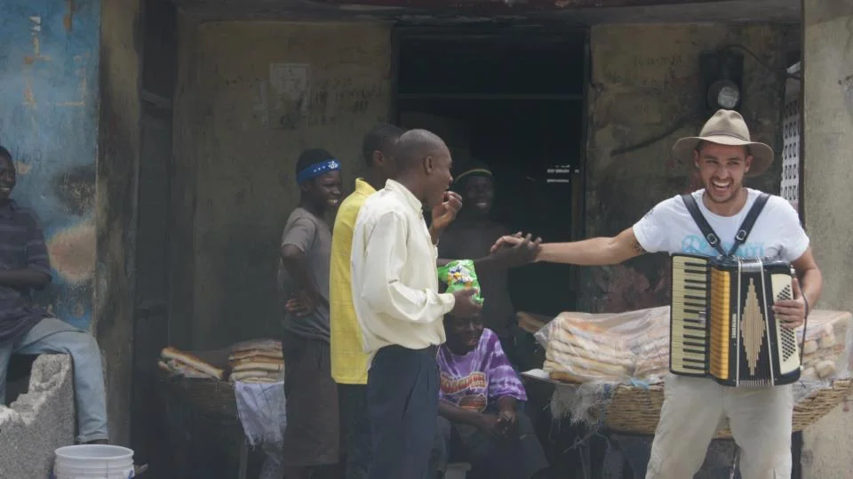 Bruno entertains new friends in Haiti.