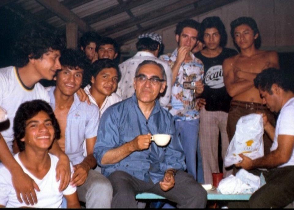 Archbishop Oscar Romero drinks coffee with a group of seminarians in El Salvador. (Photo credit: Louis Ducharme )