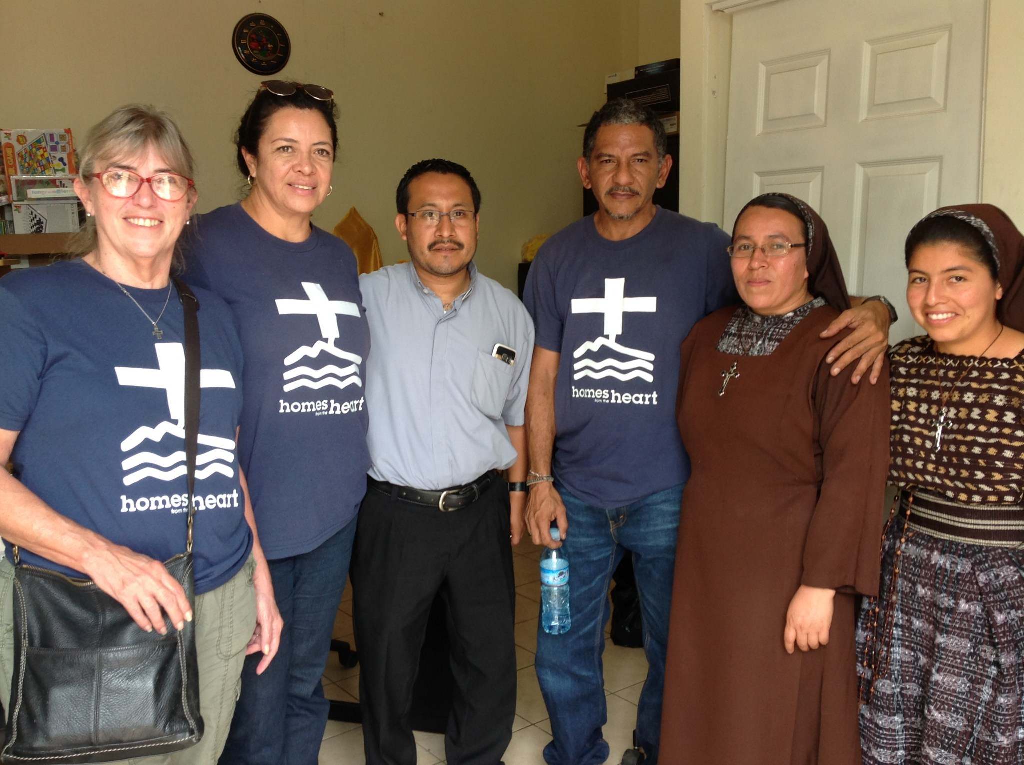 Homes_ staff with Padre Geraldo, paster of Our Lady of Guadelupe, Sr. Rosita and a young novice nun.jpg